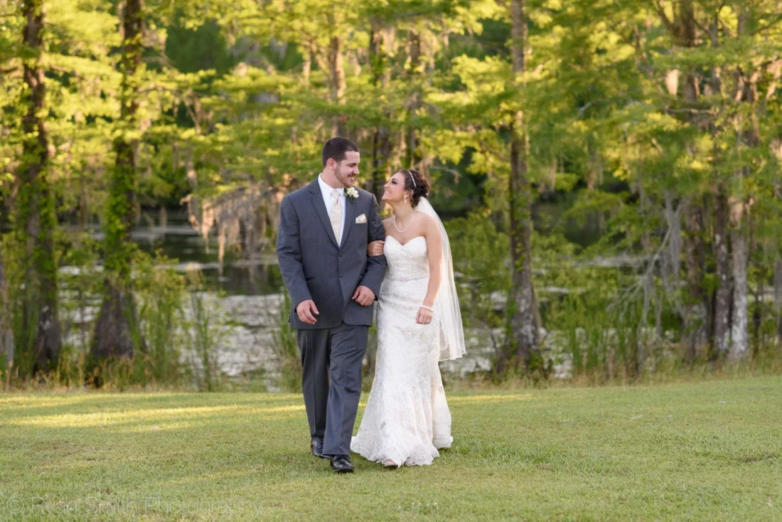 Happy couple walking towards the camera - Upper Mill Plantation