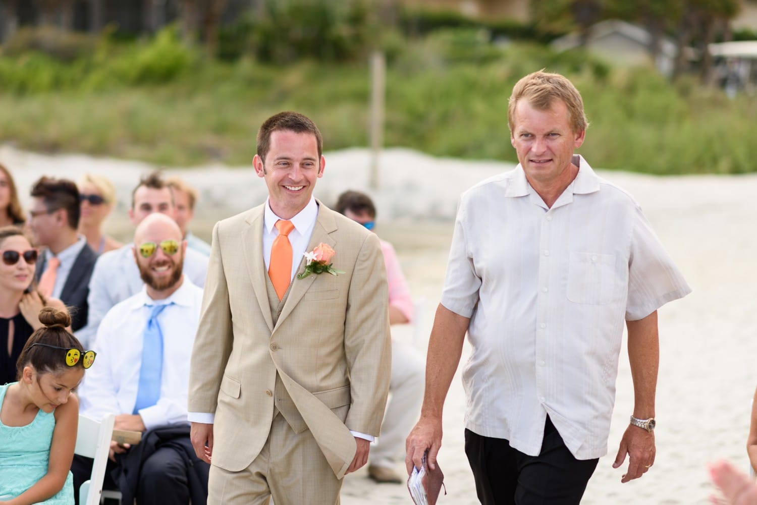Happy groom walking to ceremony - Hilton at Kingston Plantation