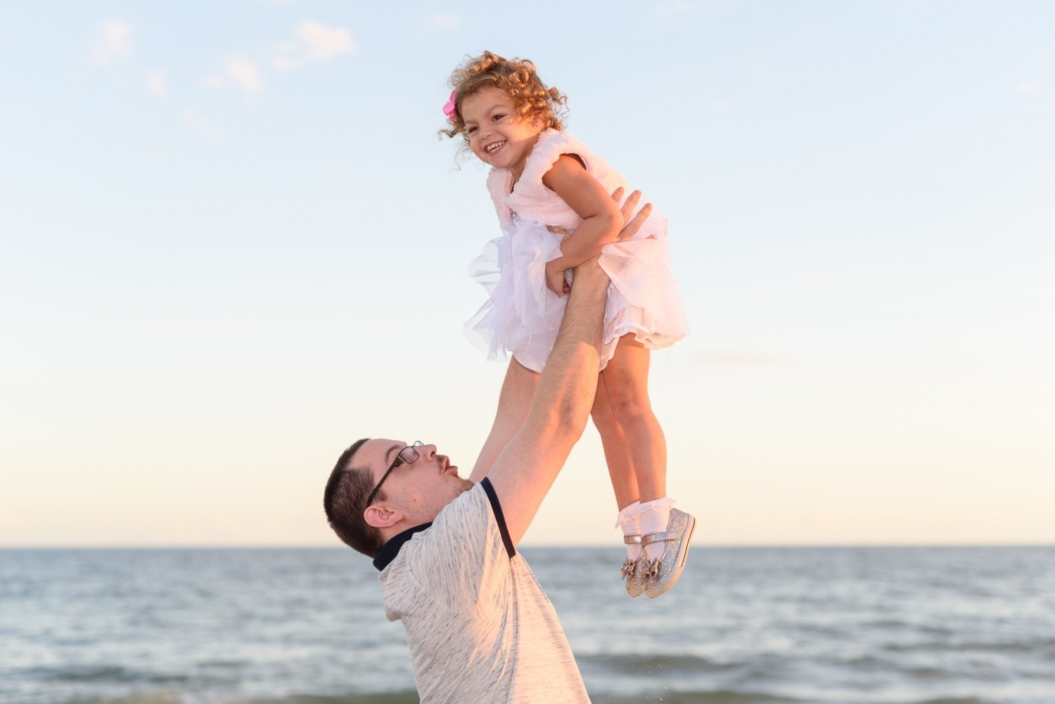 Happy little girl being lifted into the air - Huntington State Park -
