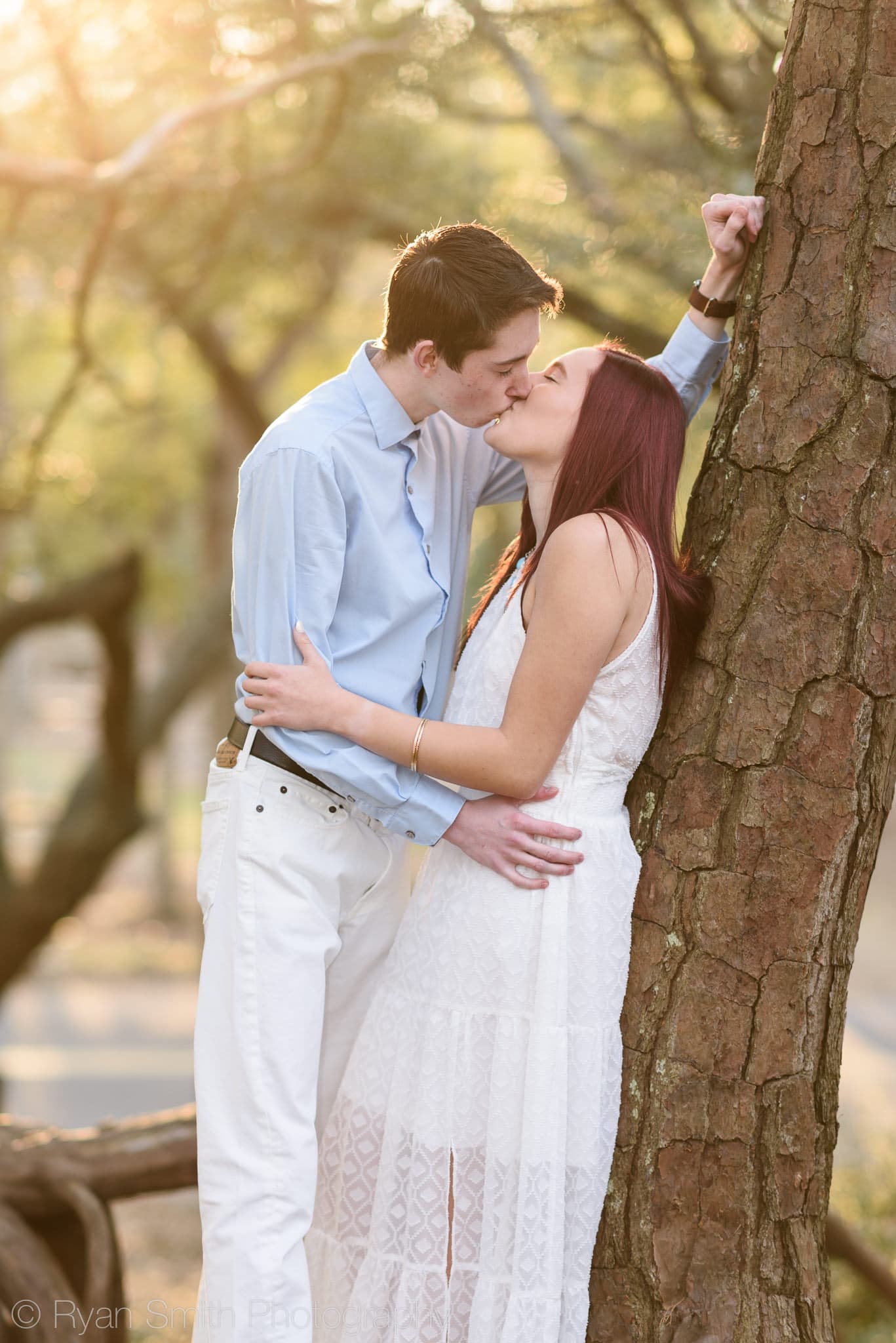 Kiss backlit by the sunlight in the trees - Myrtle Beach State Park