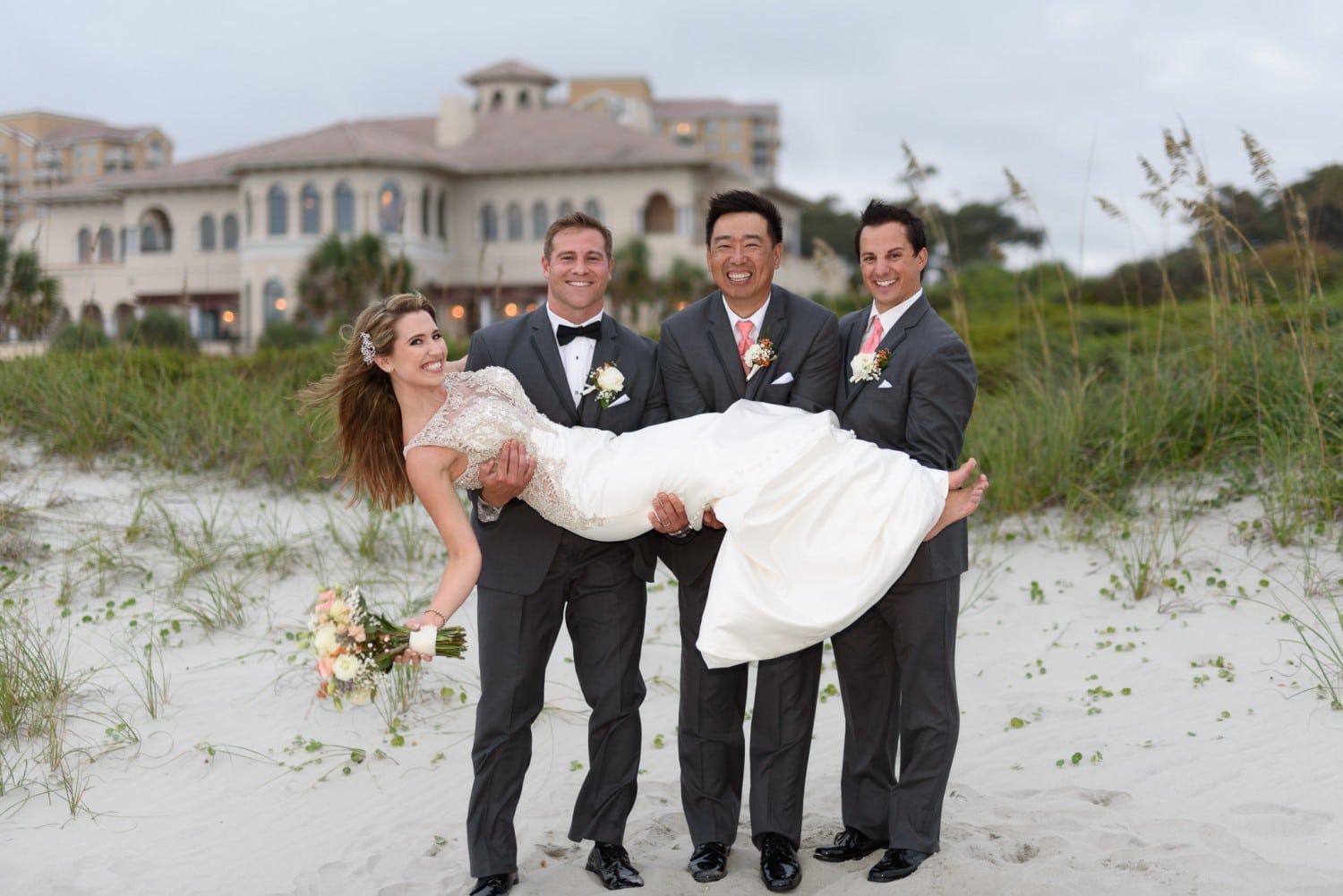Lifting bride into the air by the dunes - Grande Dunes Ocean Club - Myrtle Beach