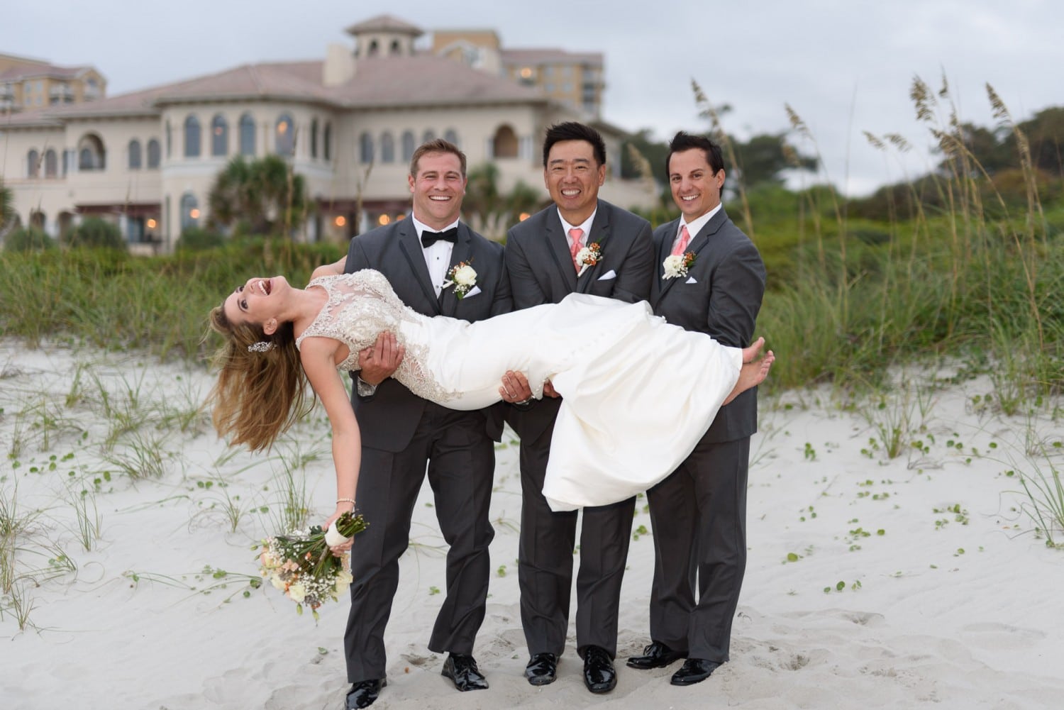 Lifting bride into the air by the dunes - Grande Dunes Ocean Club - Myrtle Beach