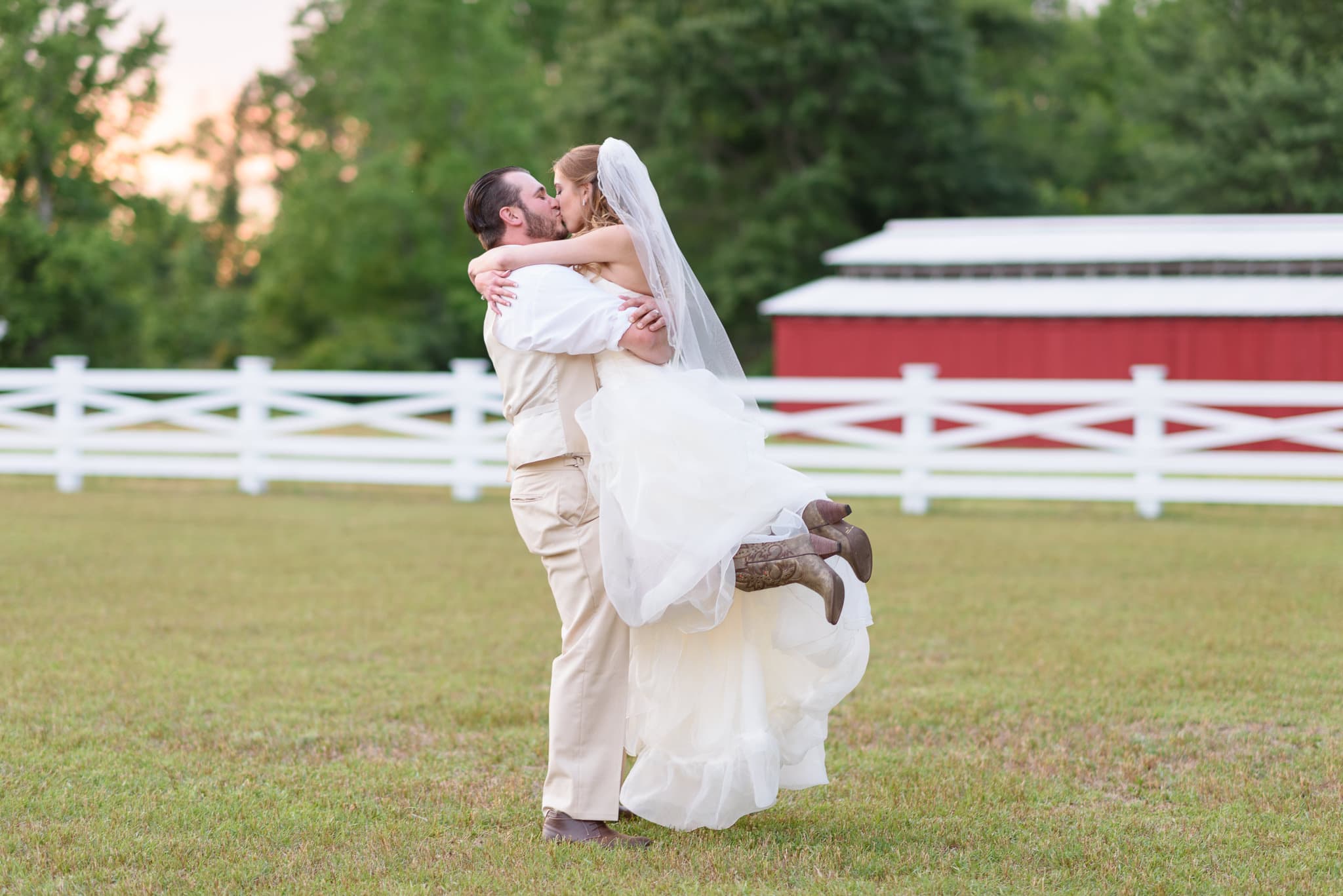 Lifting bride into the air for a kiss - Wildberry Farm