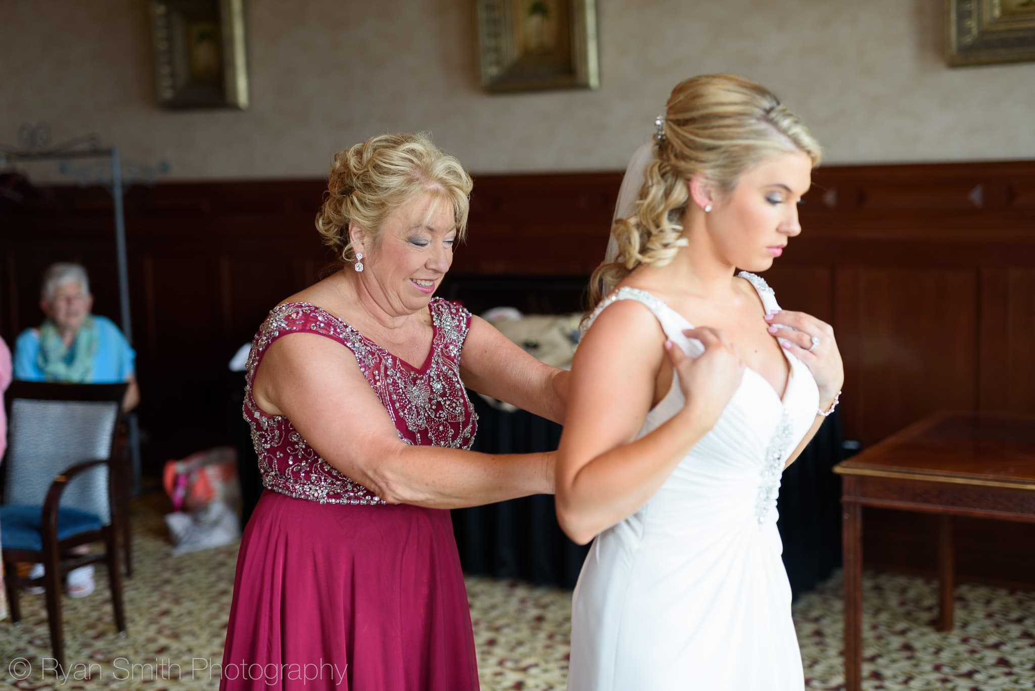 Mom helping bride with dress - Grande Dunes Ocean Club