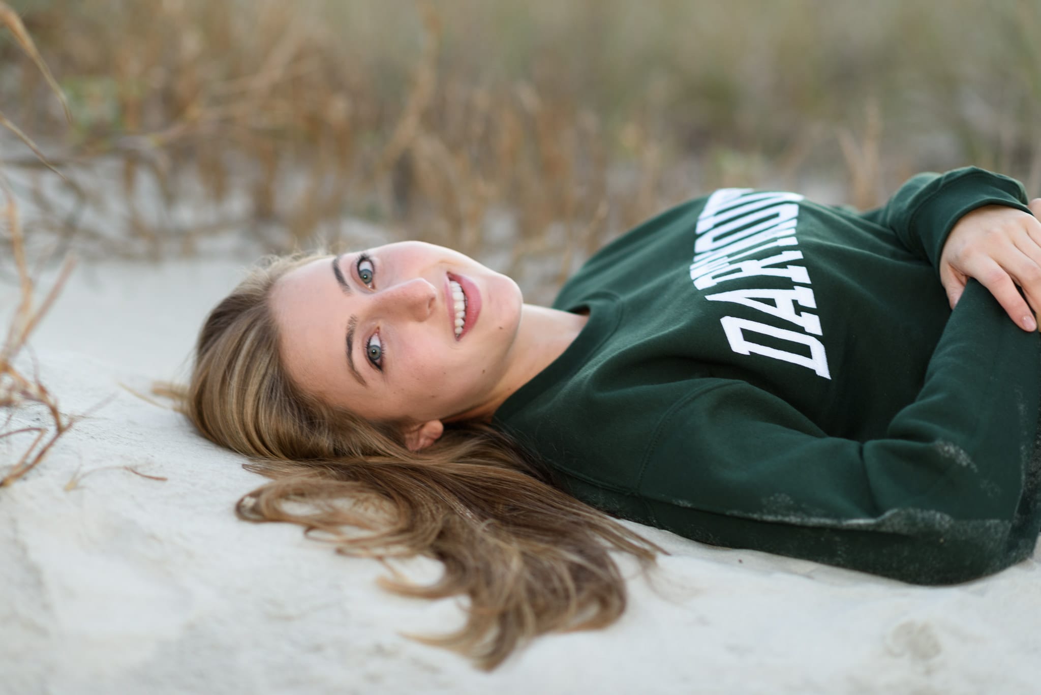 Portraits laying in the sand by the dunes - Atalaya Castle