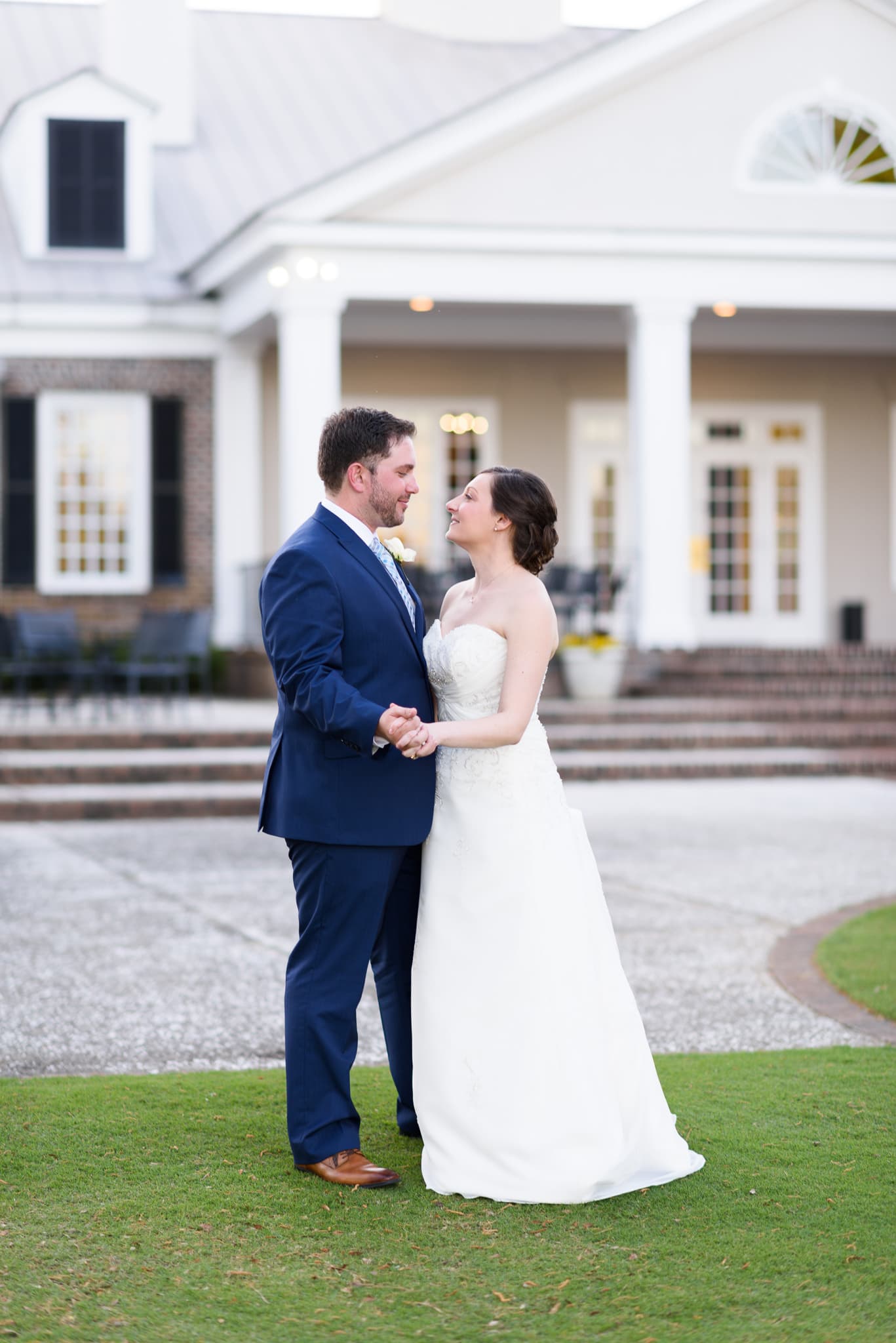Portraits of the bride and groom on the golf course at sunset - Pawleys Plantation