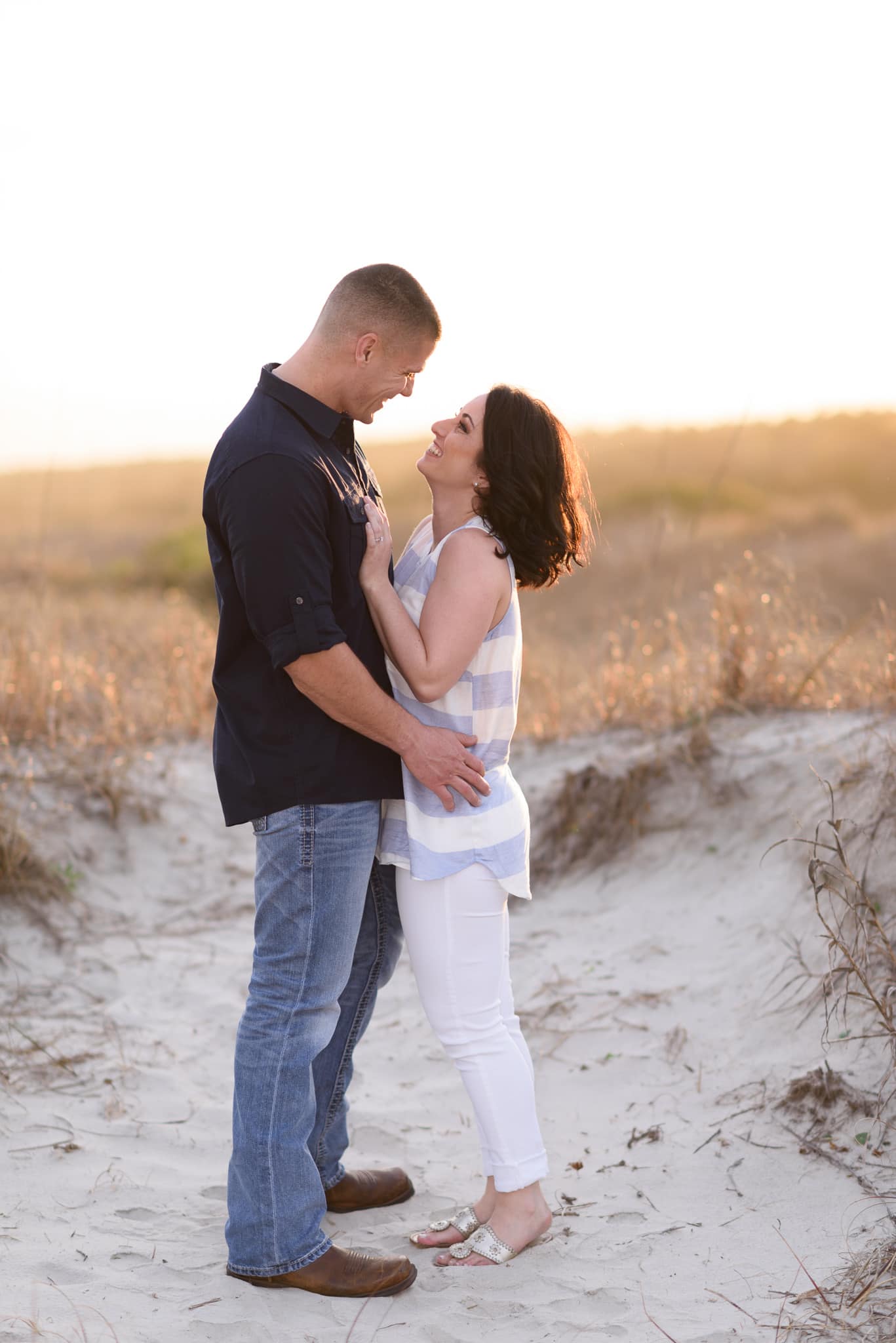 Romantic engagement portraits in front of the sea oats - Huntington State Park