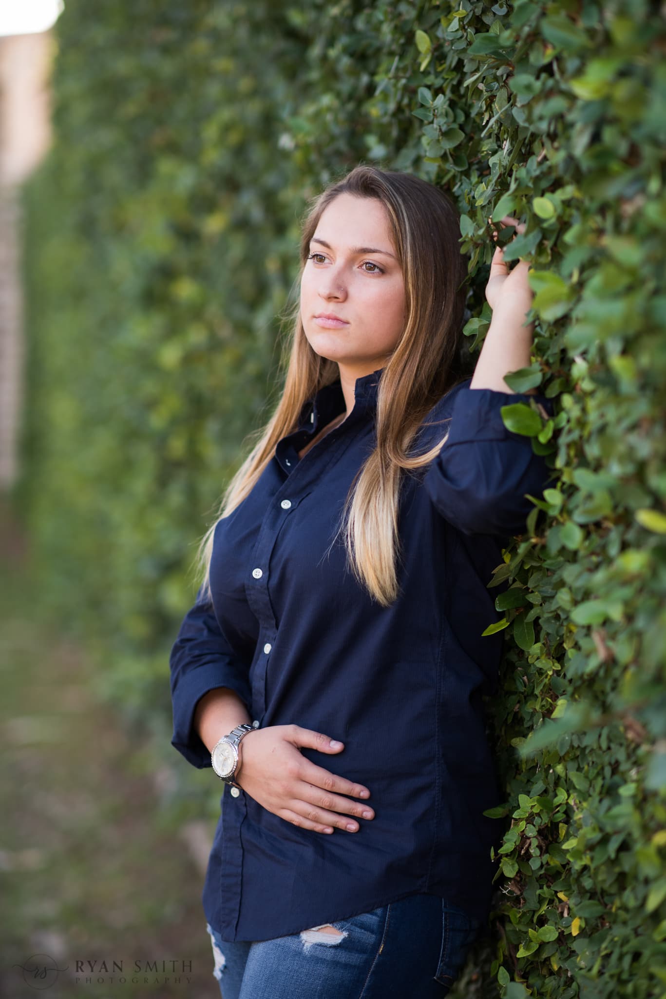 Senior portrait by the ivy covered wall - Atalaya Castle