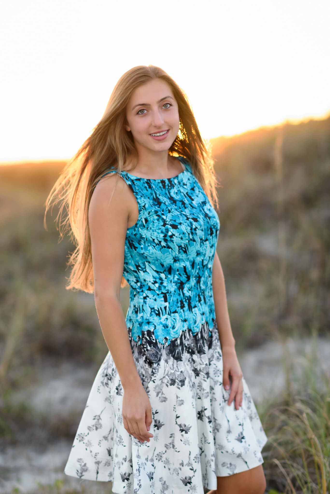 Senior portraits in the sunset by the dunes - Atalaya Castle