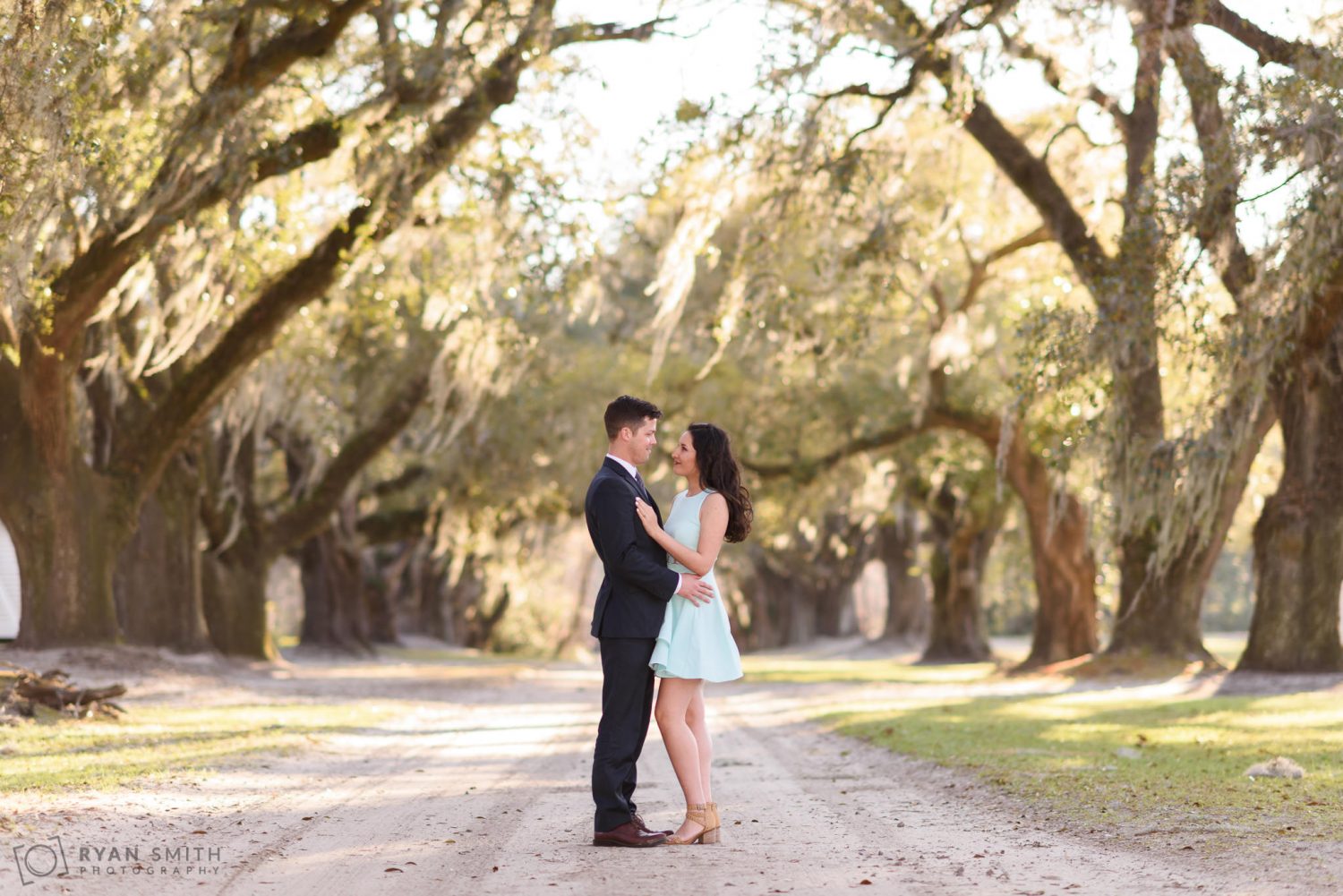 Couple looking at each other under the oak trees Mansfield Plantation, Georgetown