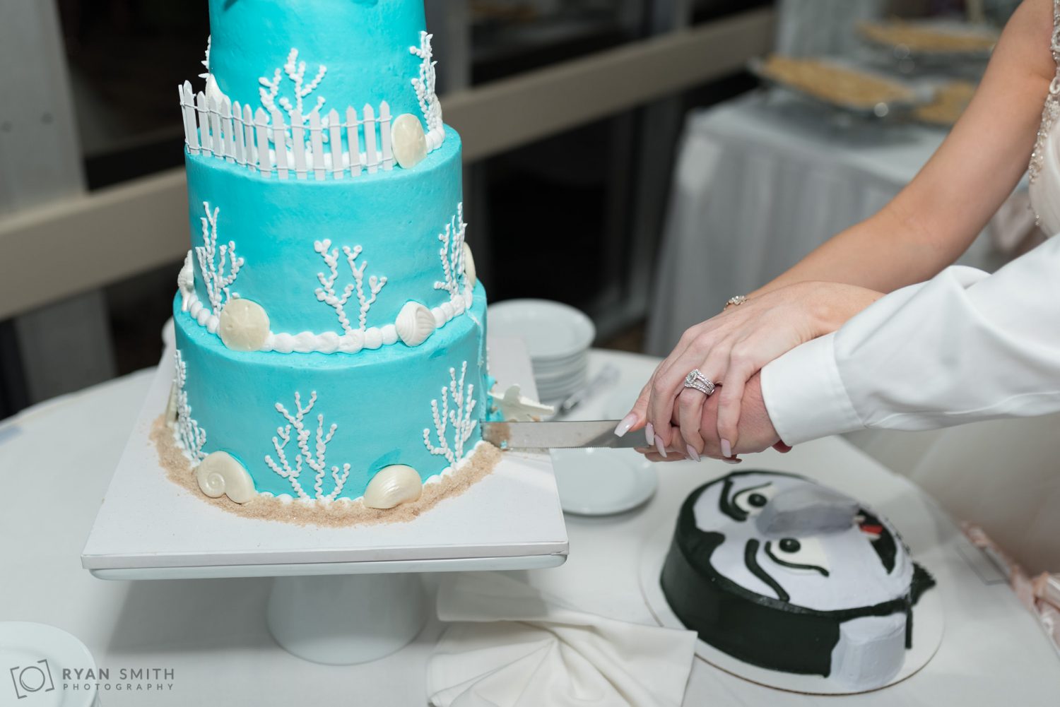 Bride and groom cutting the cake Hilton Ballroom in Myrtle Beach