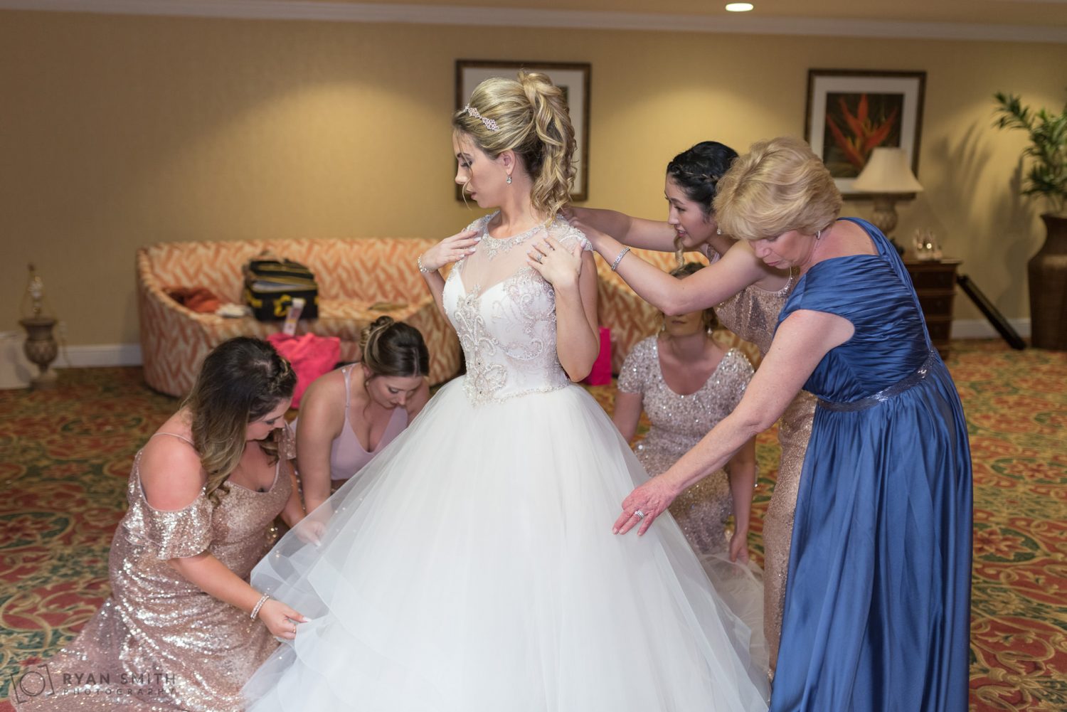 Bridesmaids helping bride get ready Hilton Myrtle Beach Resort