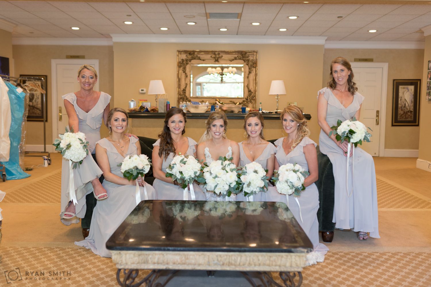 Bride and bridesmaids sitting on couch Pawleys Plantation
