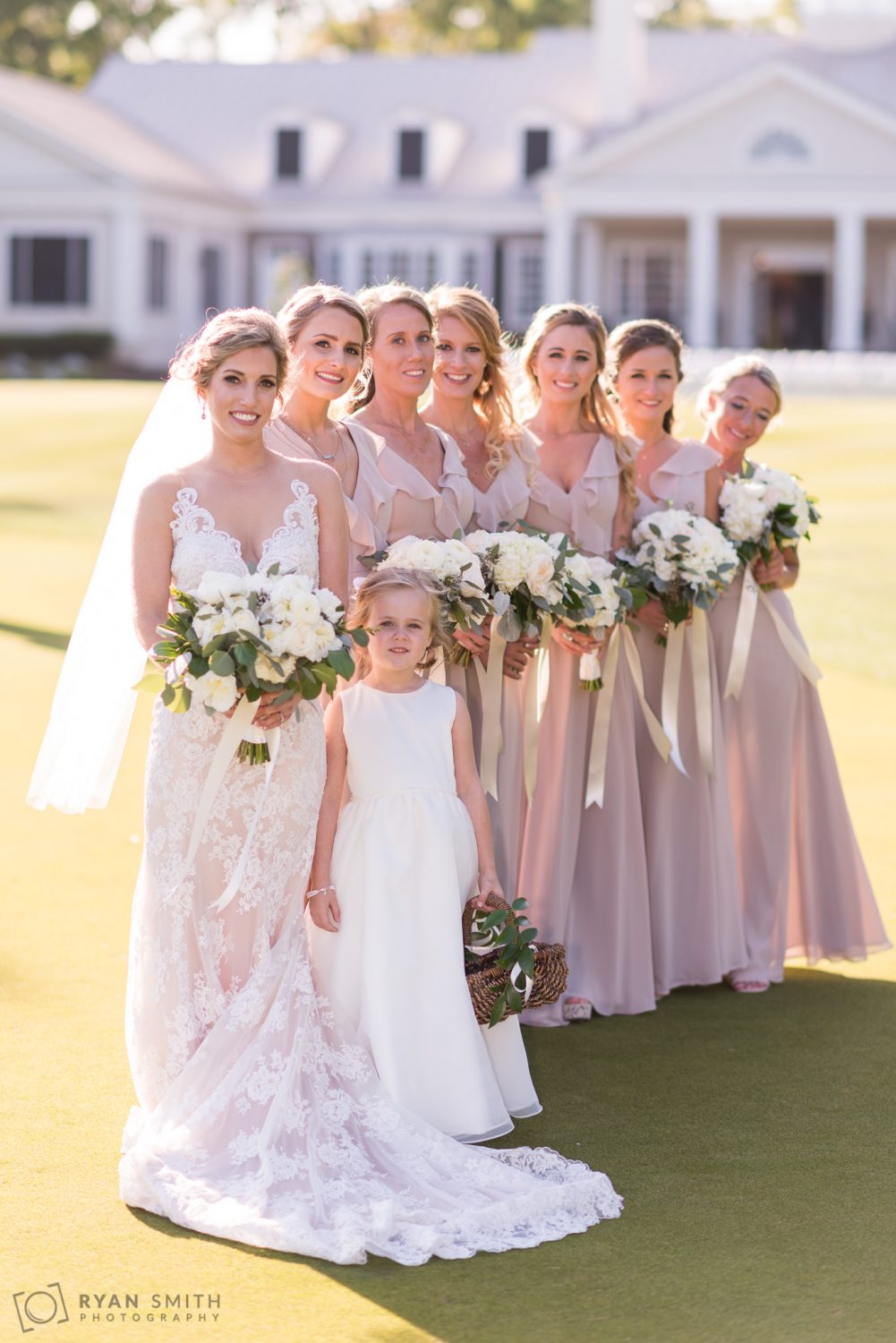 Bridesmaids with clubhouse in background Pawleys Plantation
