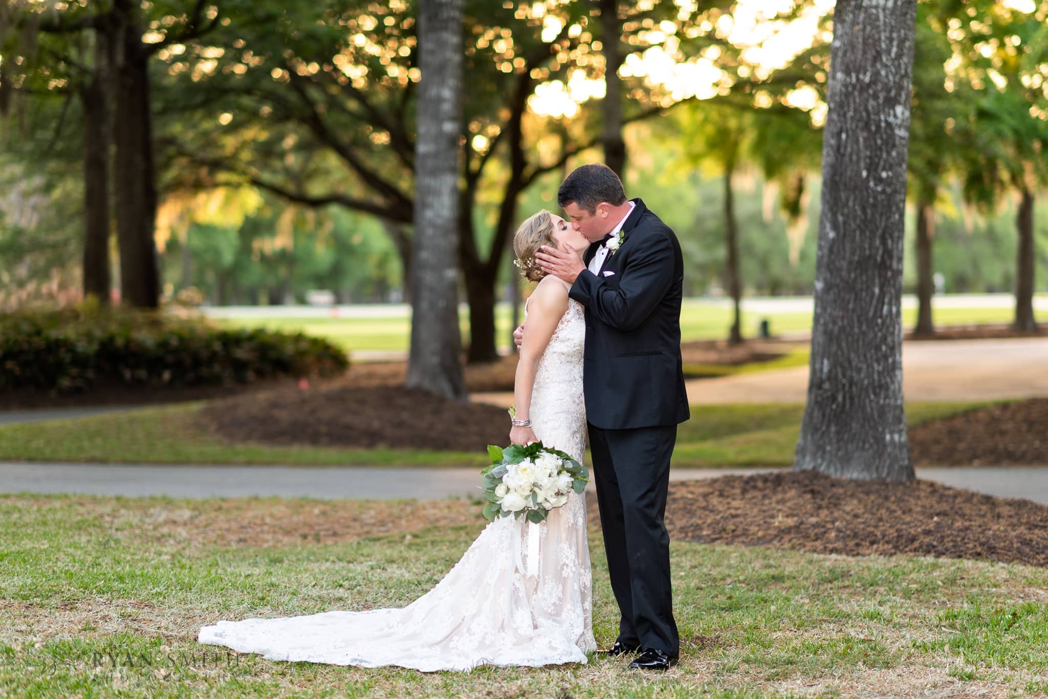 Kiss in the sunset in front of the clubhouse - Pawleys Plantation