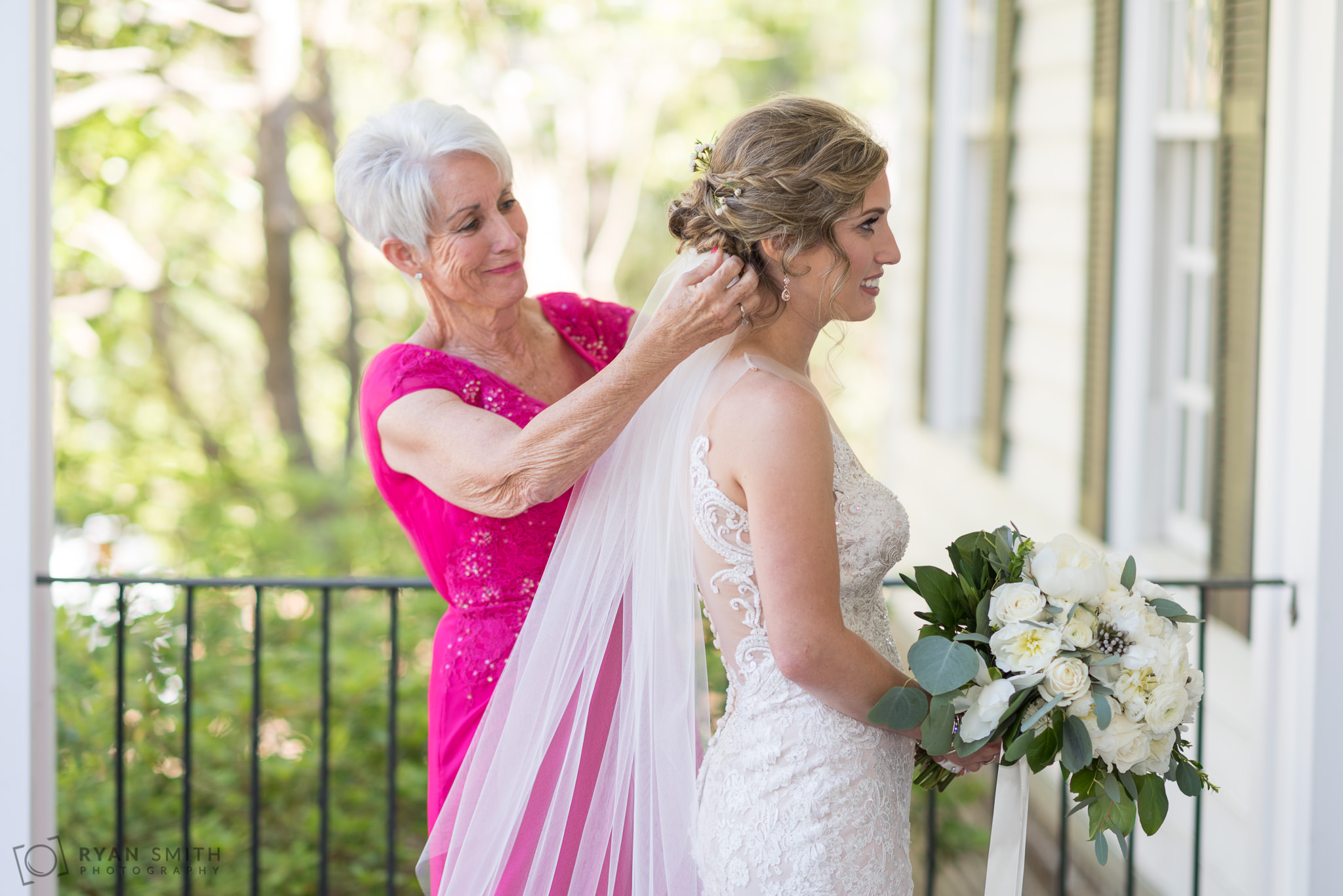 Mom helping the bride with her veil  Pawleys Plantation