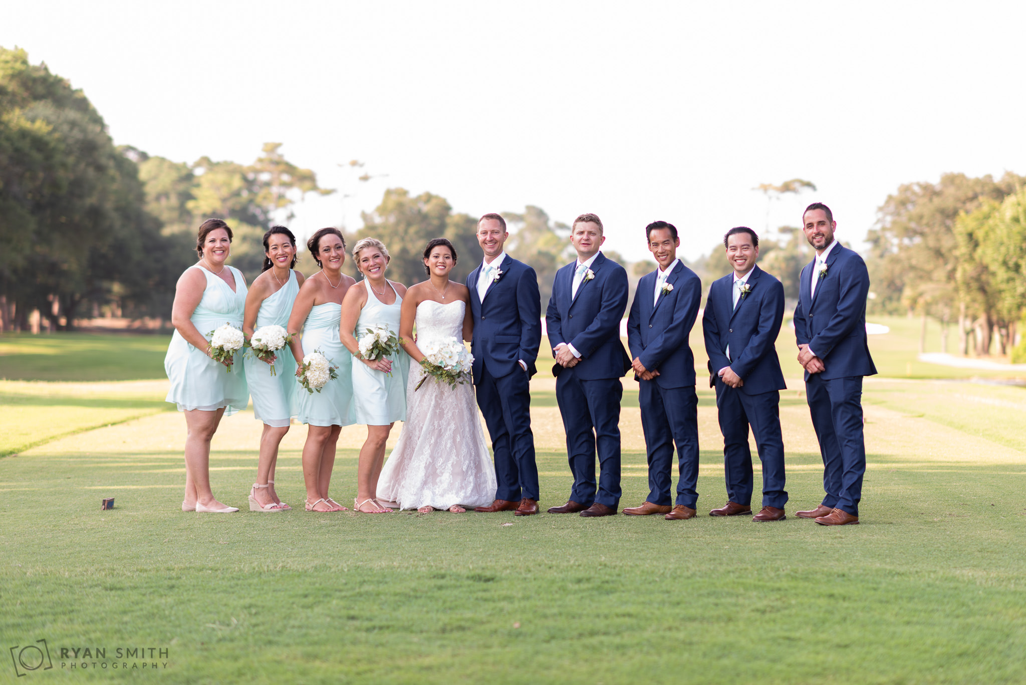 Bridal party on the golf course Dunes Golf and Beach Club