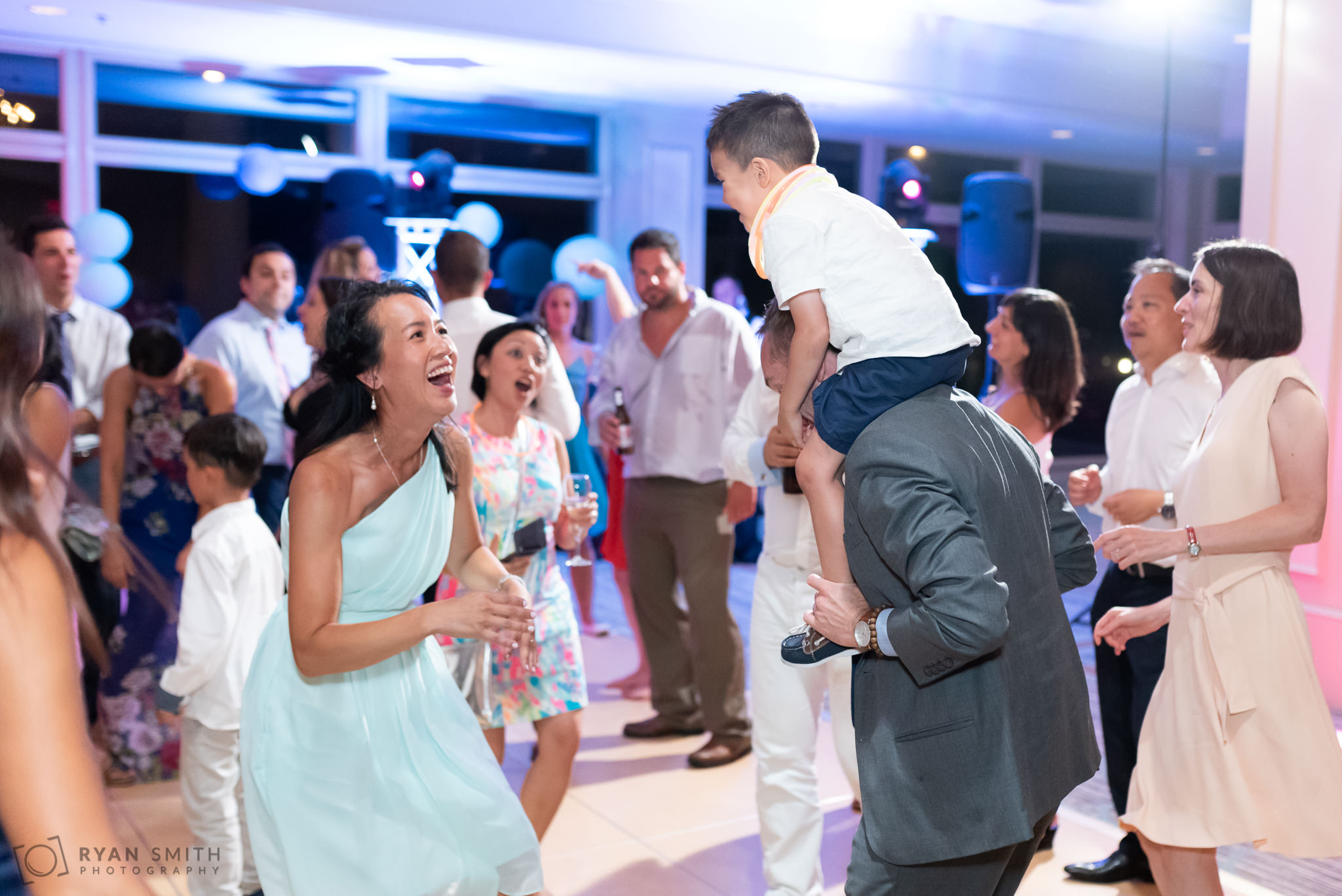 Fun dancing during the wedding reception Dunes Golf and Beach Club