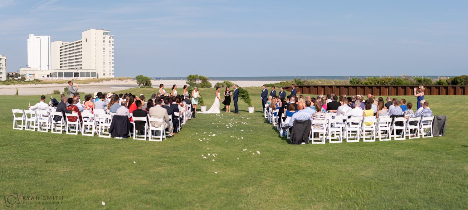 Panorama of ceremony on the lawn Dunes Golf and Beach Club