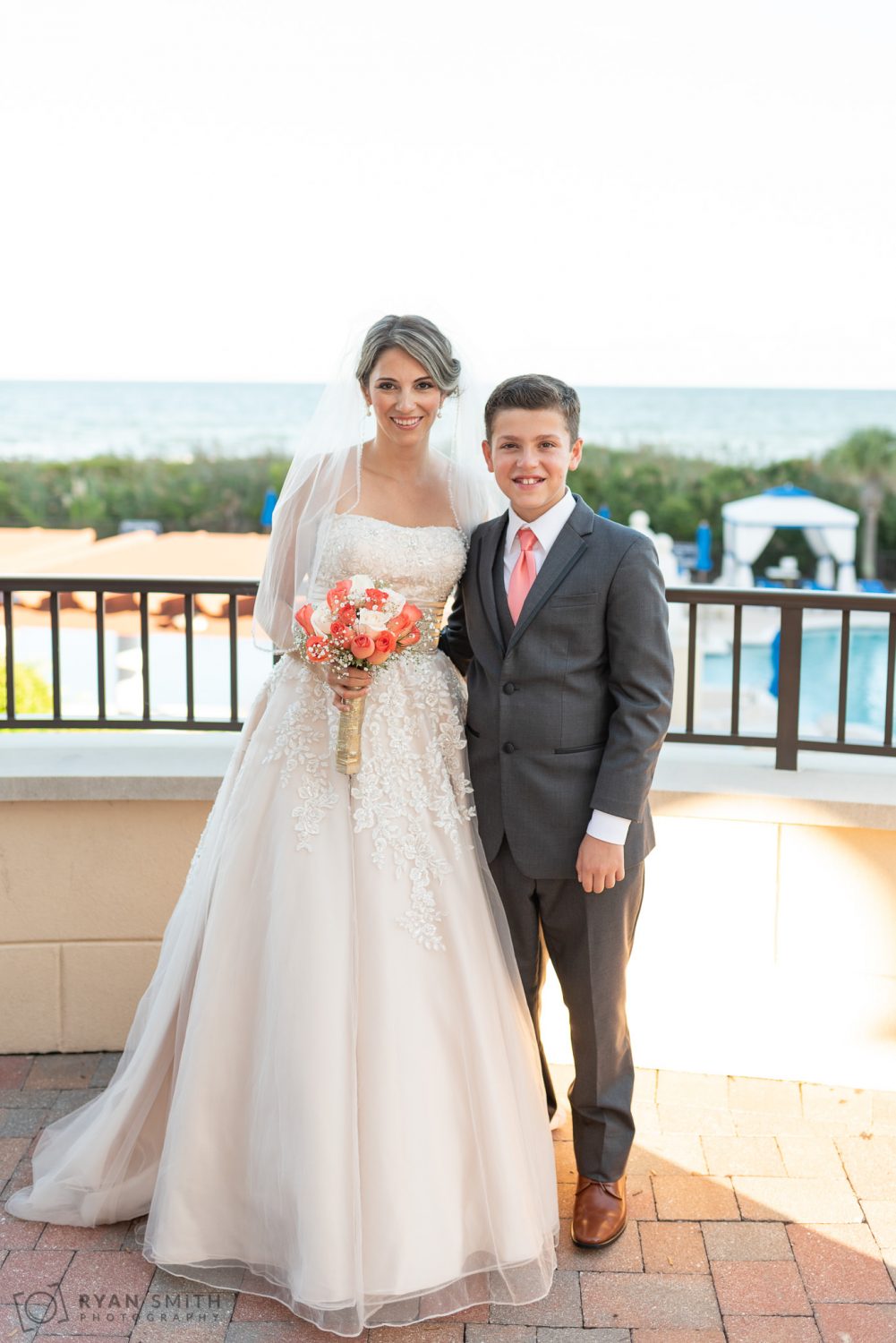 Bride and son on the balcony Grande Dunes Ocean Club