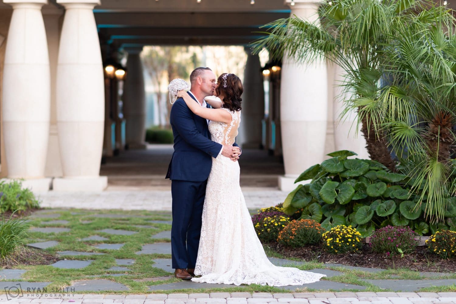 Bride kissing groom 21 Main Events at North Beach