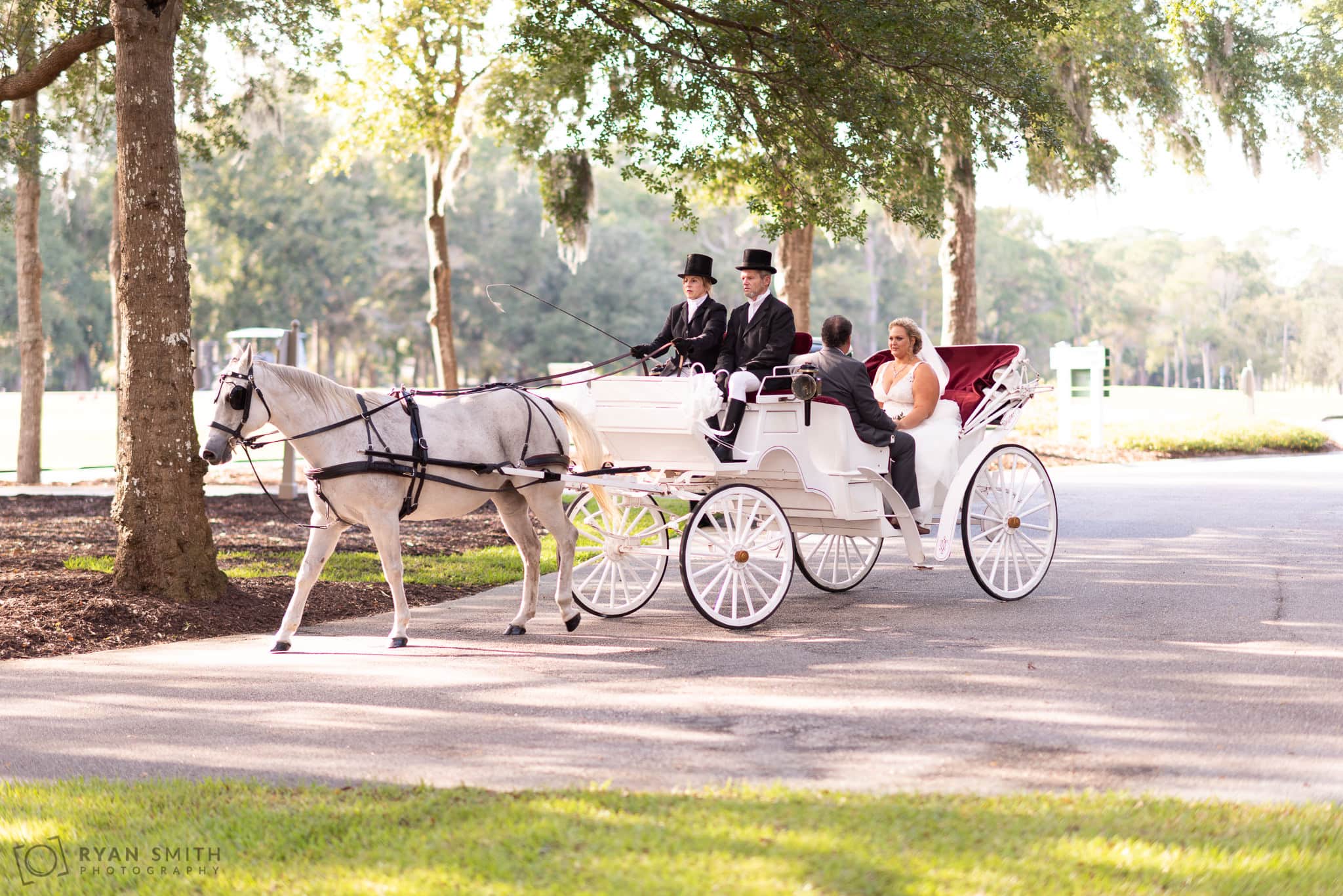 Bride arriving on carriage with father