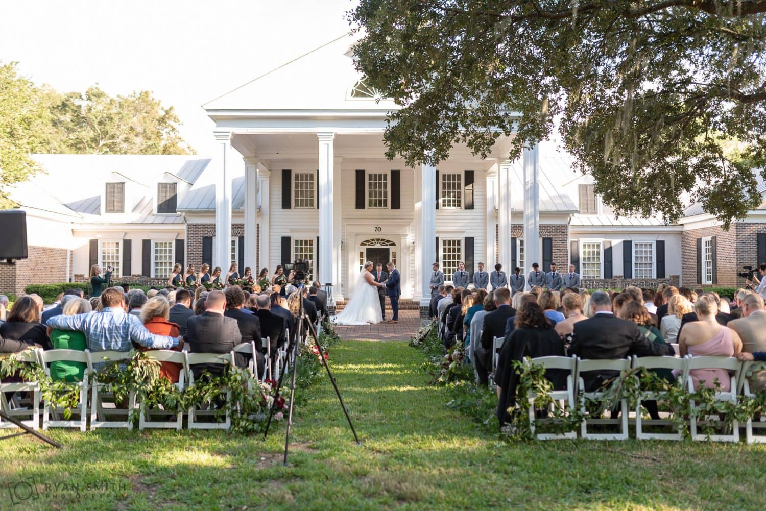 Ceremony on the front lawn by the columns