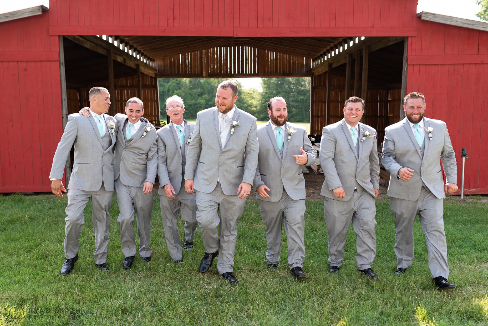 Groomsmen walking out of the barn Wildberry Farm