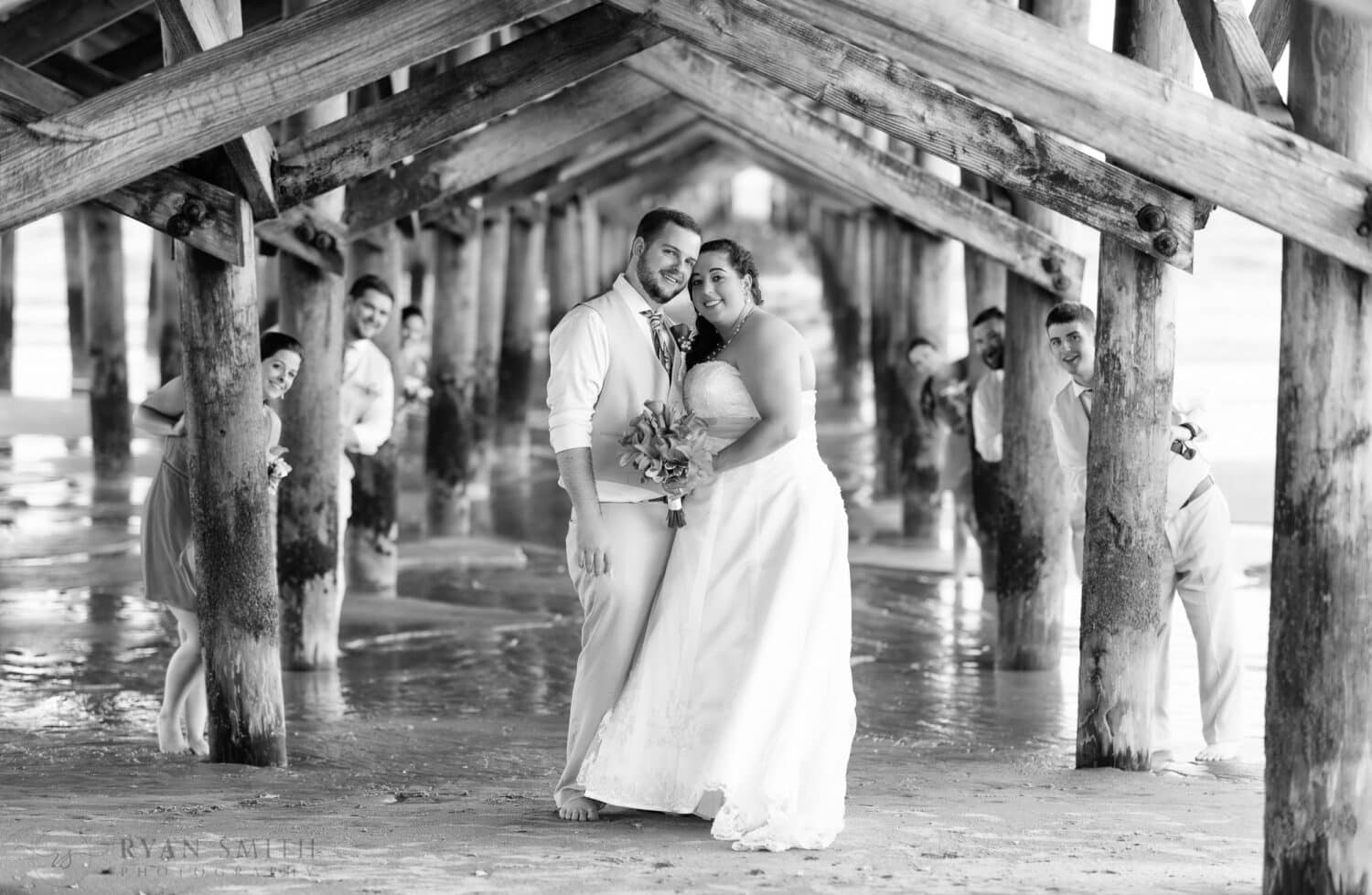 Bridal party hiding behind the Springmaid pier - Myrtle Beach