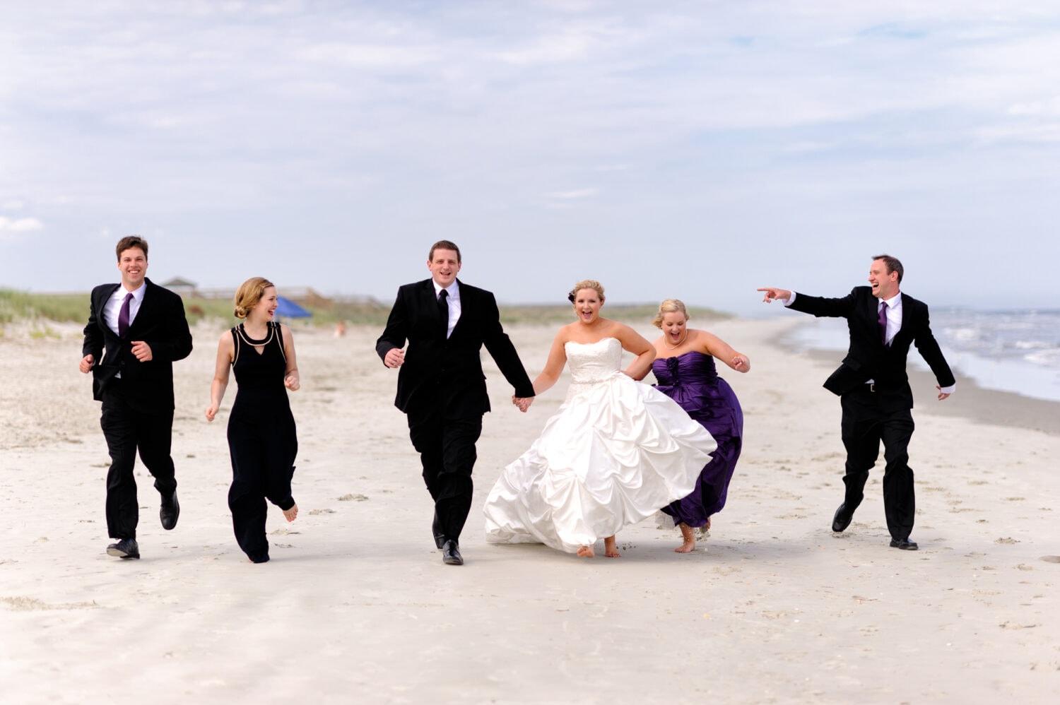 Bridal party running down the beach - Pawleys Island