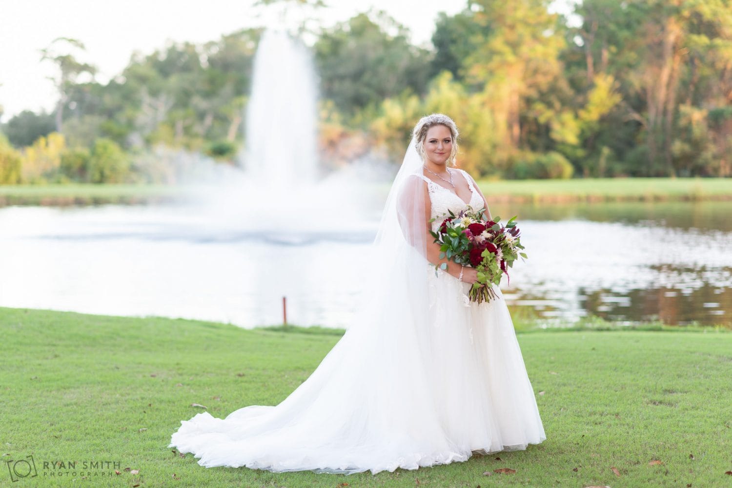 Bride in front of the fountain Pawleys Plantation Golf & Country Club