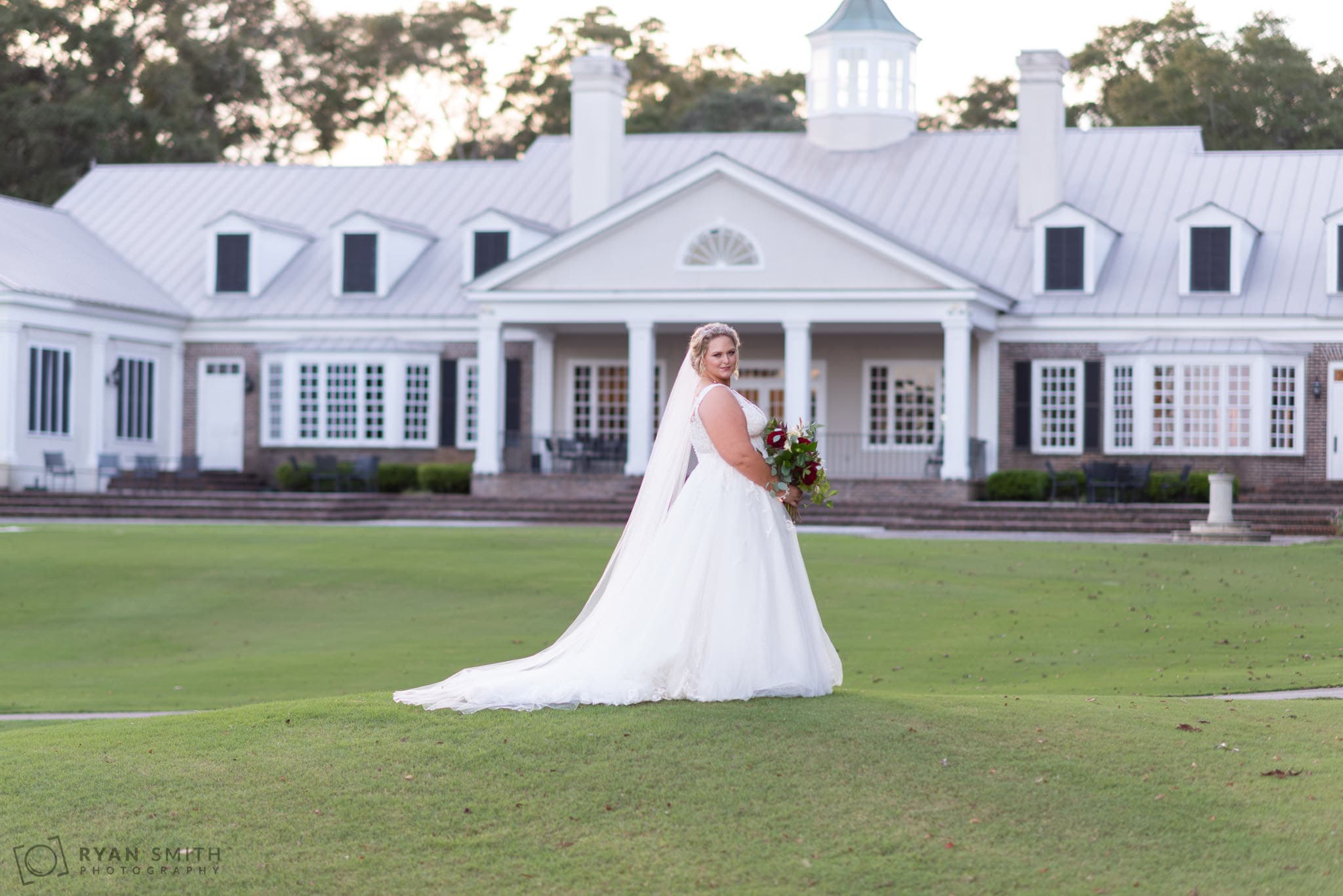 Bride looking over her shoulder  Pawleys Plantation Golf & Country Club