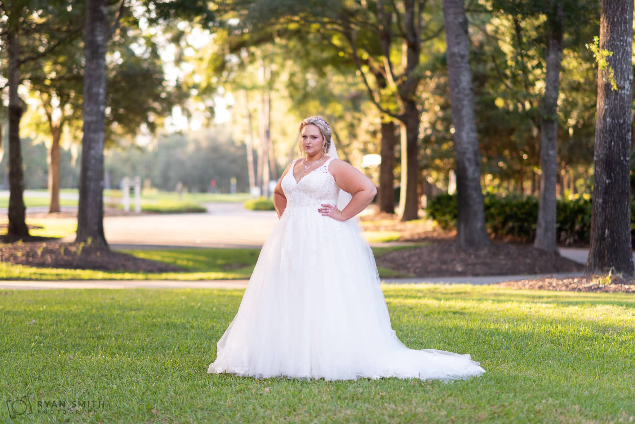 Bride posing in the sunset Pawleys Plantation Golf & Country Club