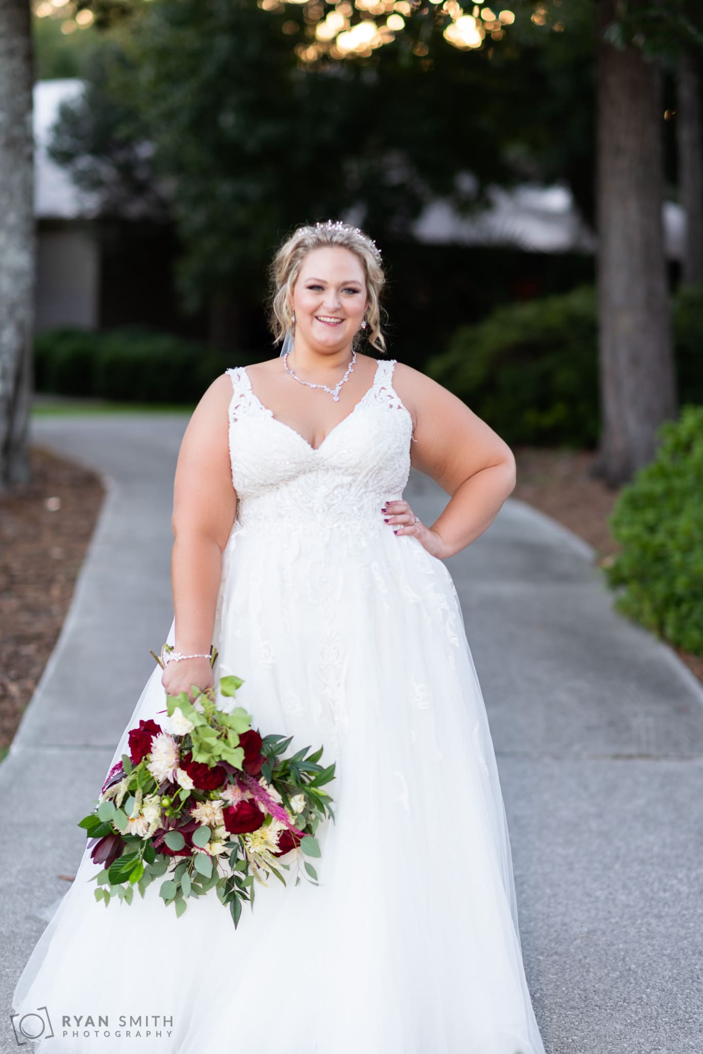 Bride smiling on the golf course path Pawleys Plantation Golf & Country Club