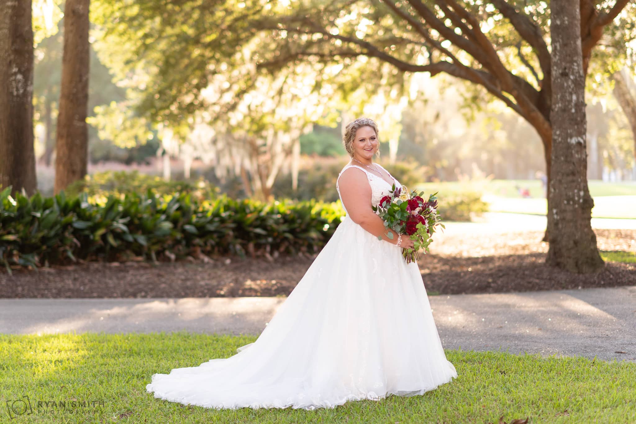 Bride standing in front of the trees Pawleys Plantation Golf & Country Club