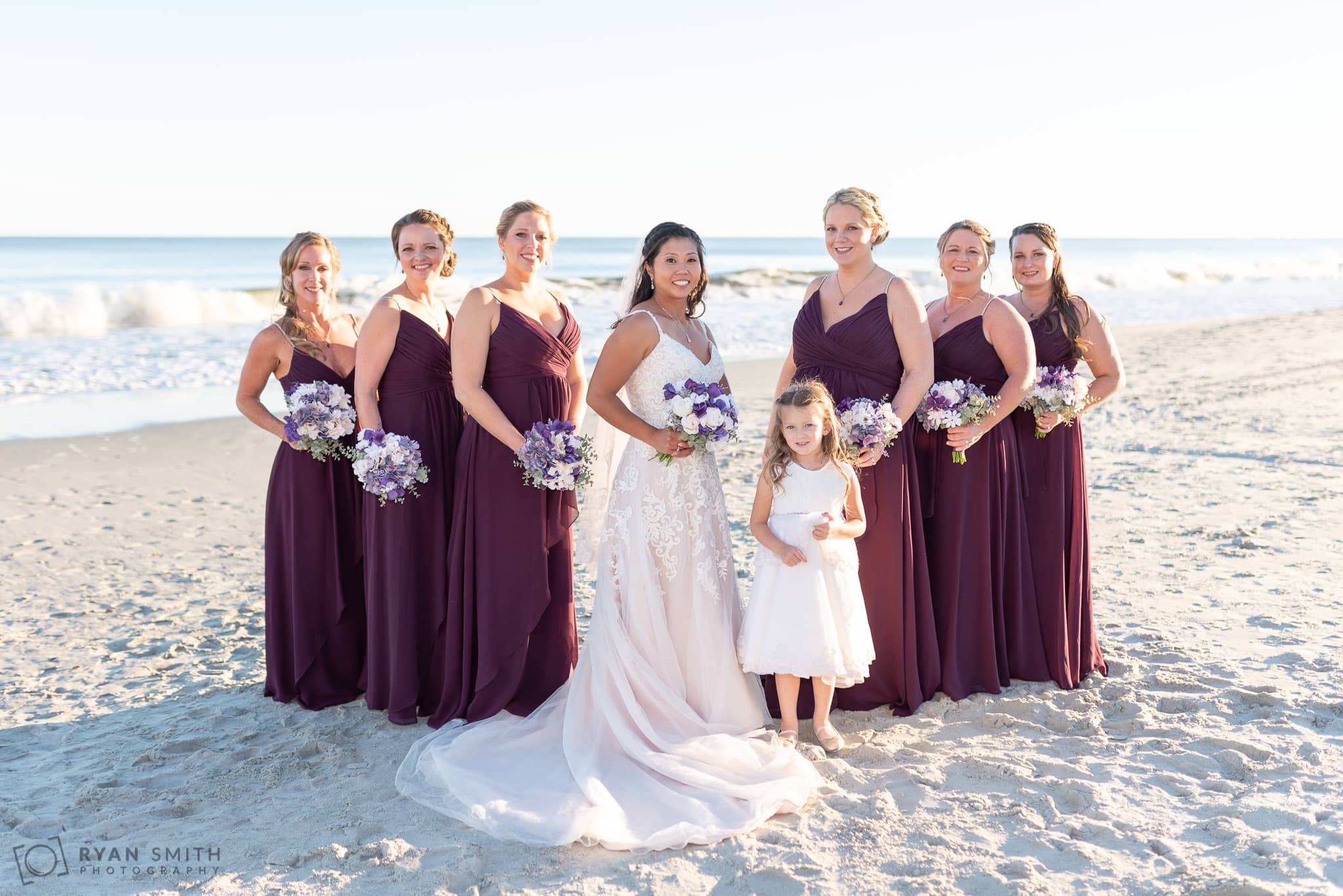 Bride with bridesmaids in front of the ocean 21 Main Events at North Beach