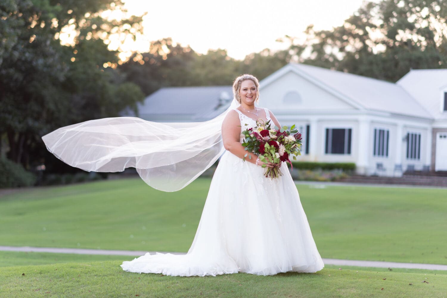 Bride with veil blowing behind her - Pawleys Plantation Golf & Country Club