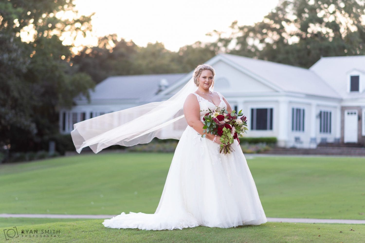 Bride with veil flowing behind her Pawleys Plantation Golf & Country Club