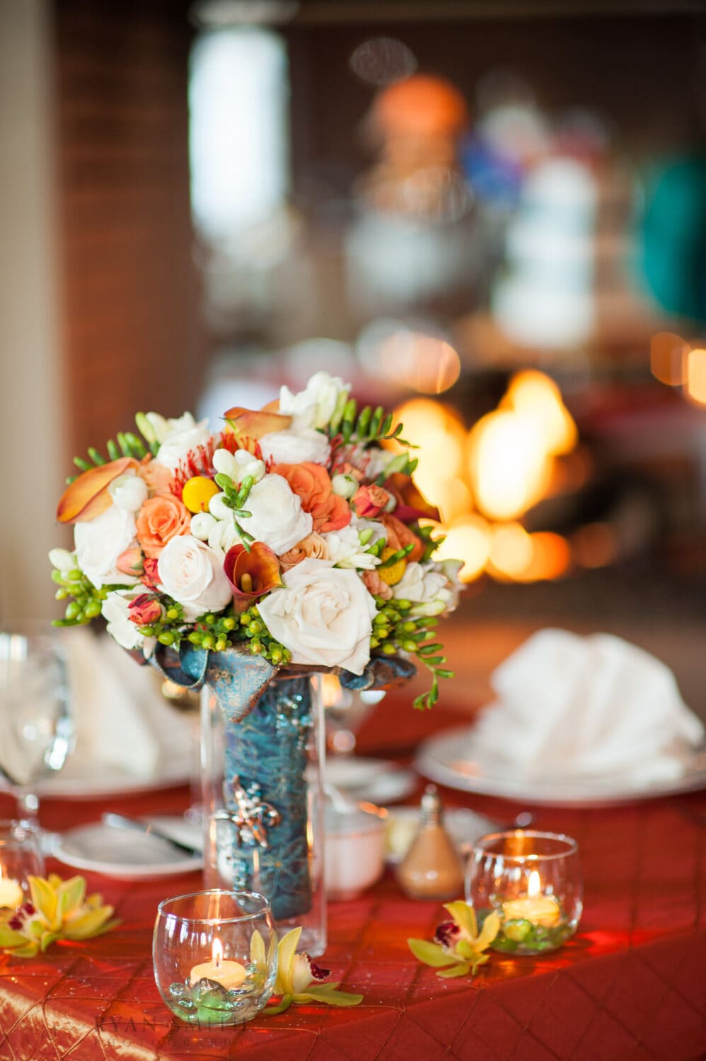 Bride's flowers with a fire in the background - Ocean Club