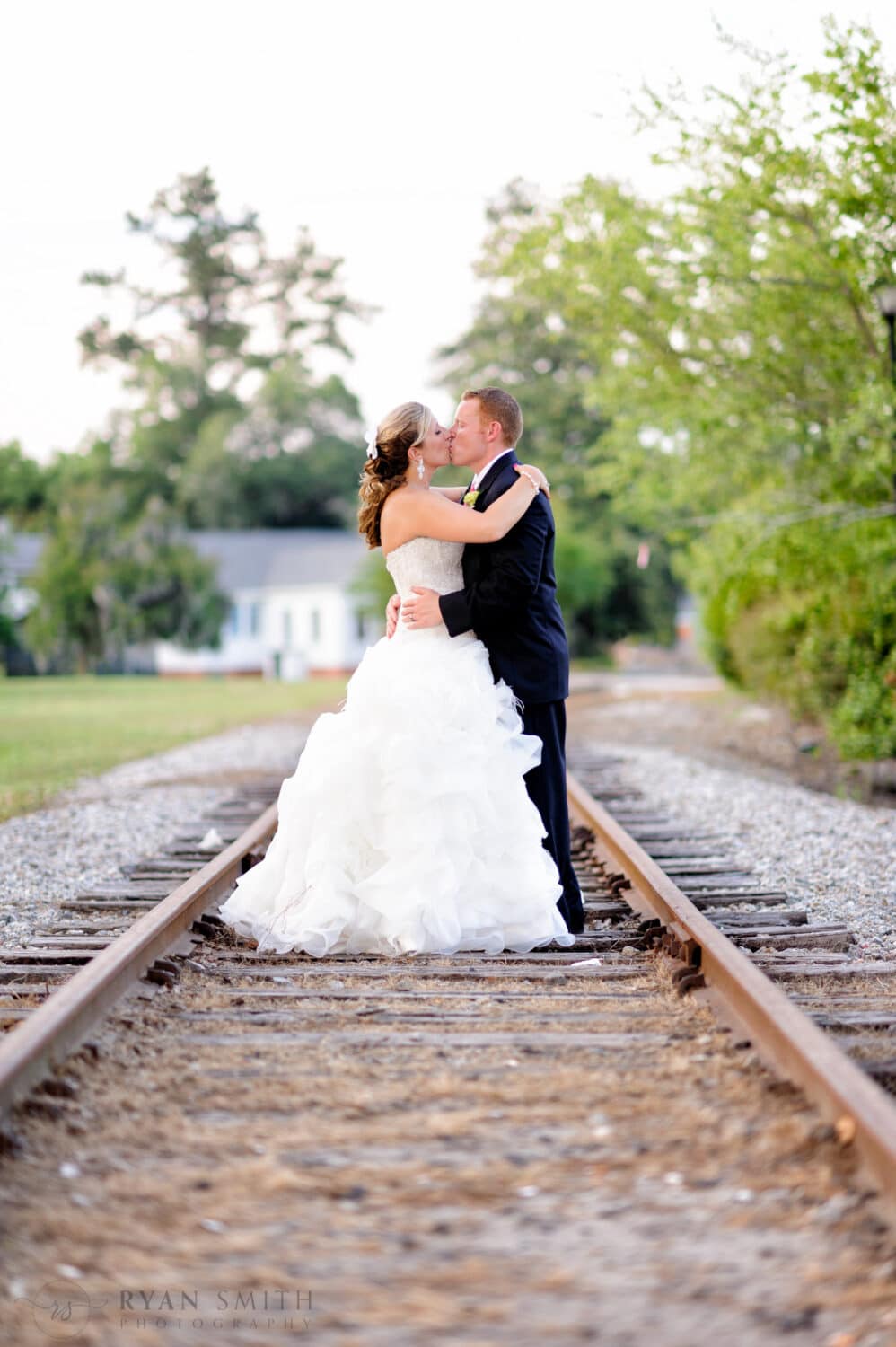 Couple kissing on the train tracks - Conway River Walk
