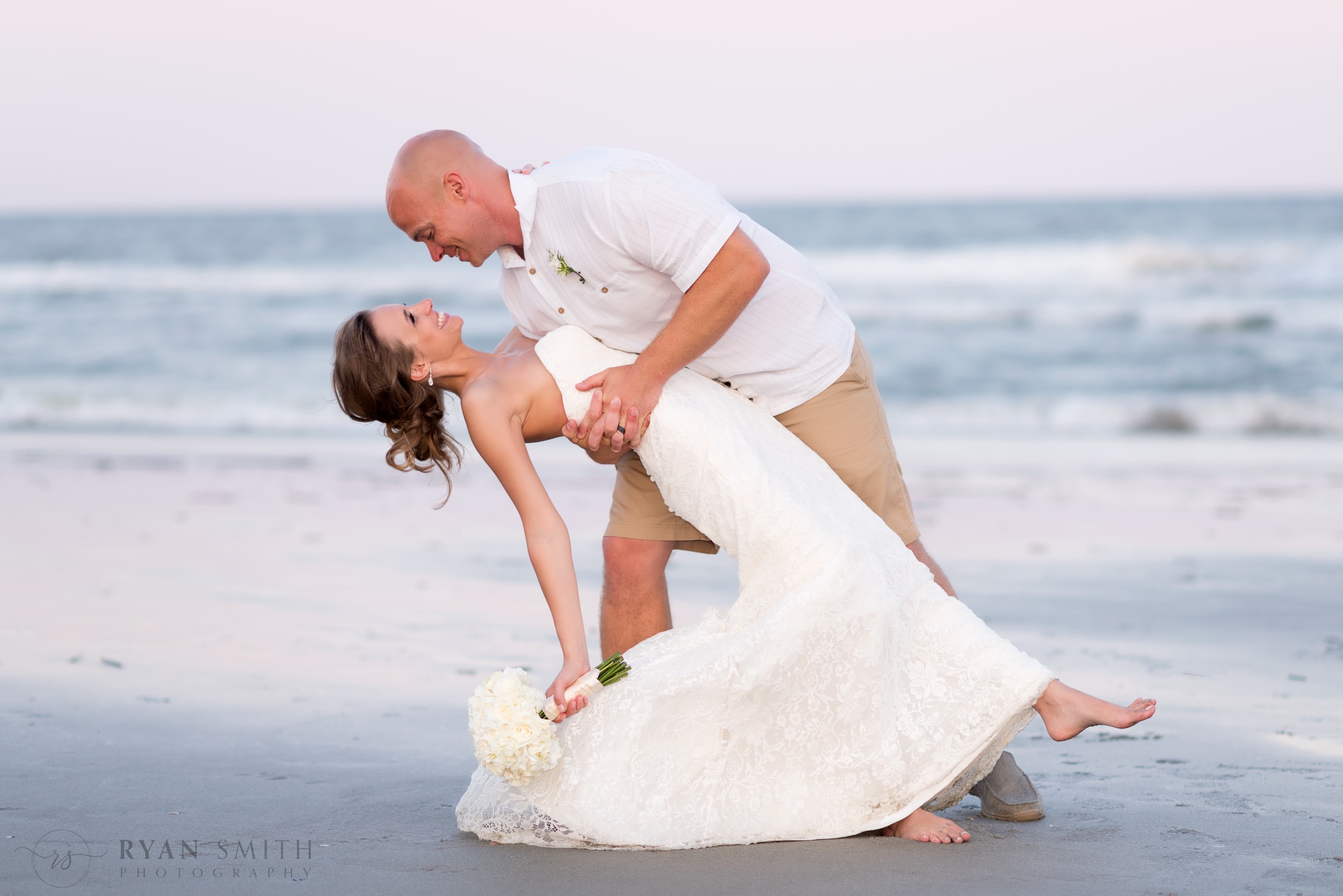 Dipping bride back in front of ocean - Myrtle Beach
