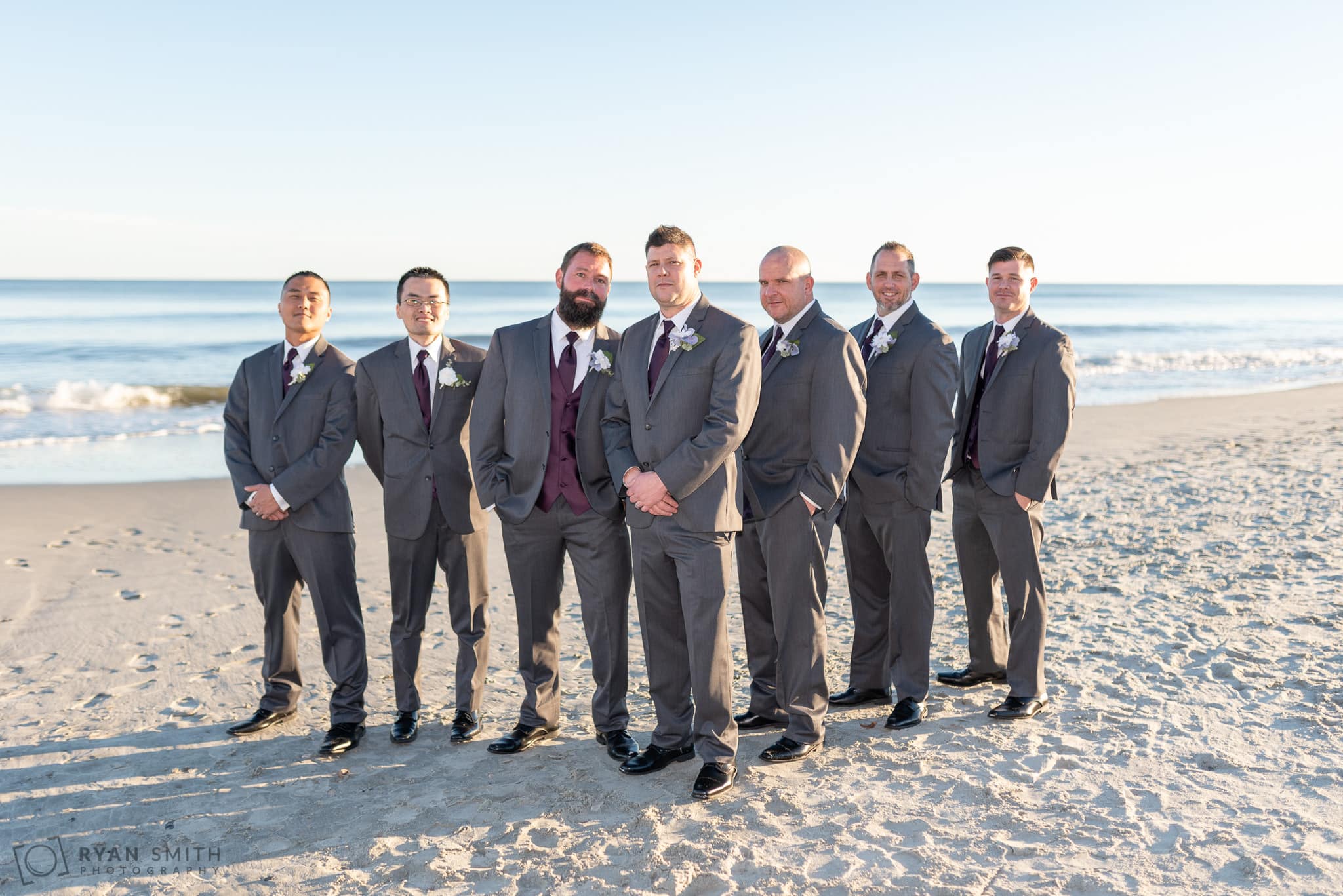 Groom with groomsmen in front of the ocean 21 Main Events at North Beach