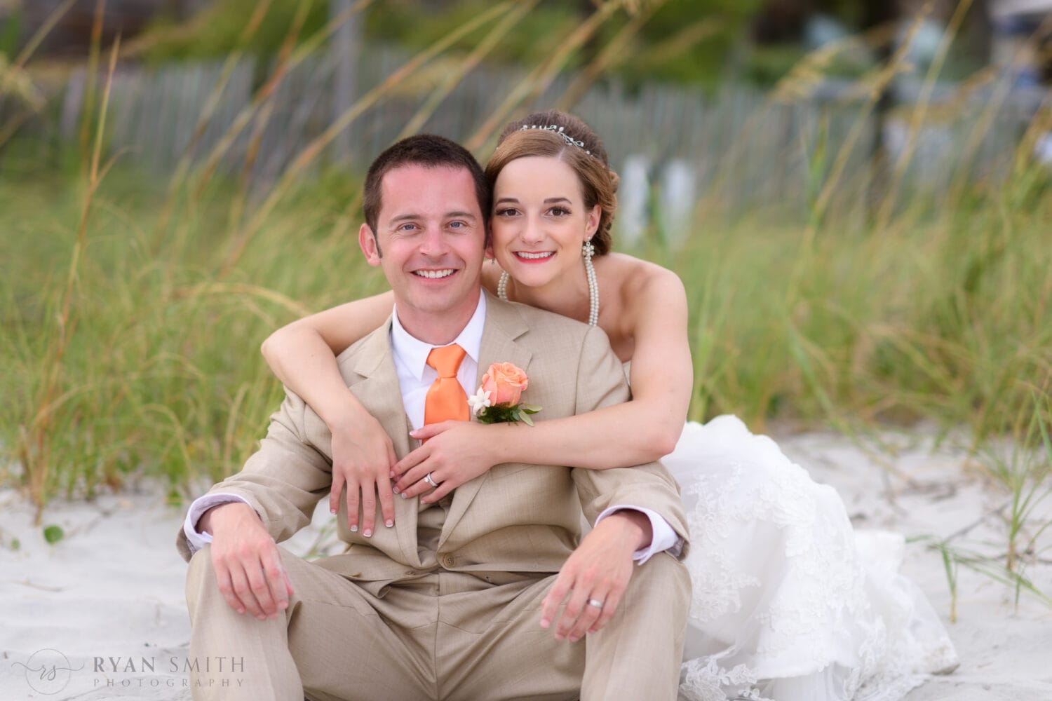 Happy couple in front of the dunes - Kingston Plantation