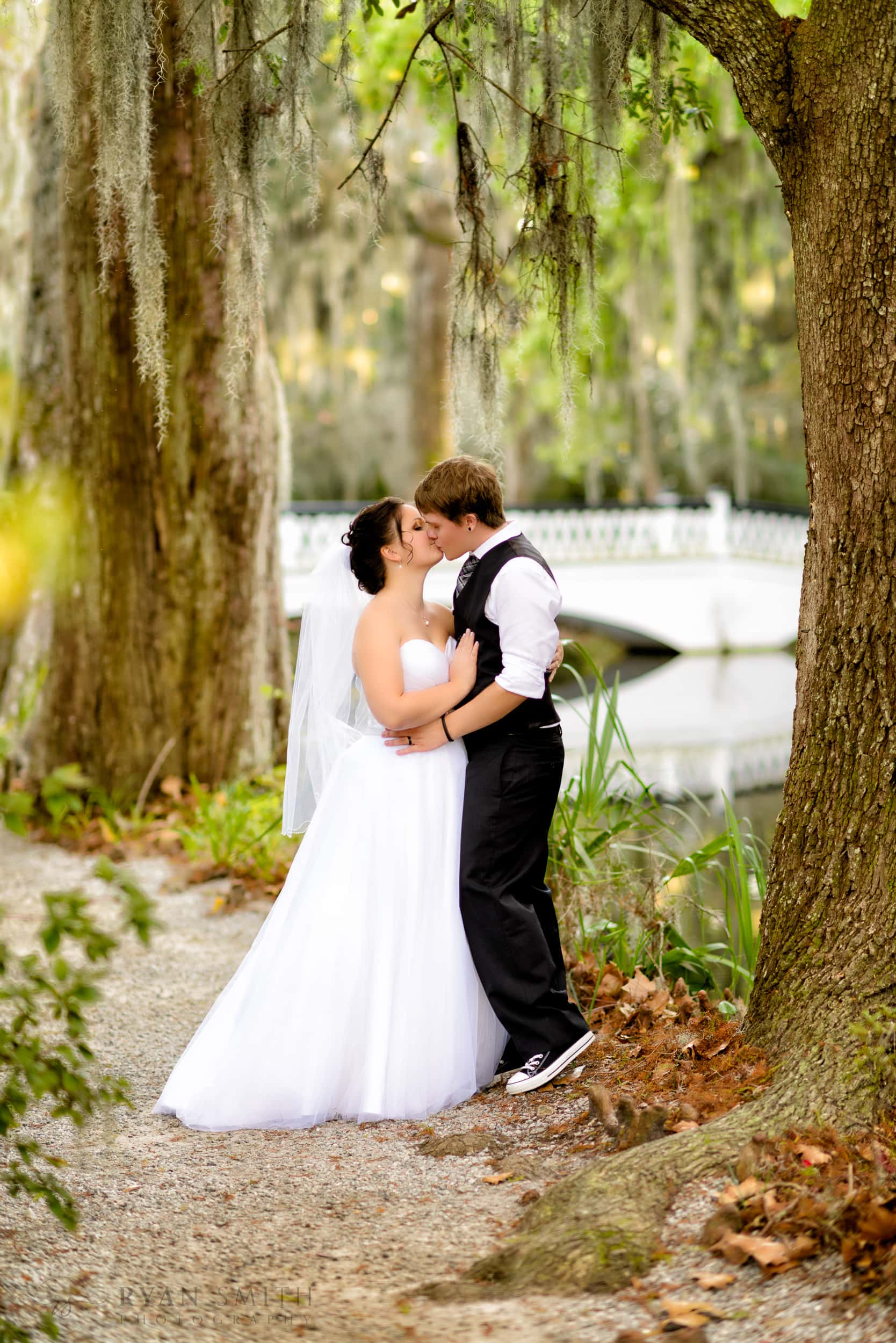 Young married couple in front of the white bridge - Magnolia Plantation