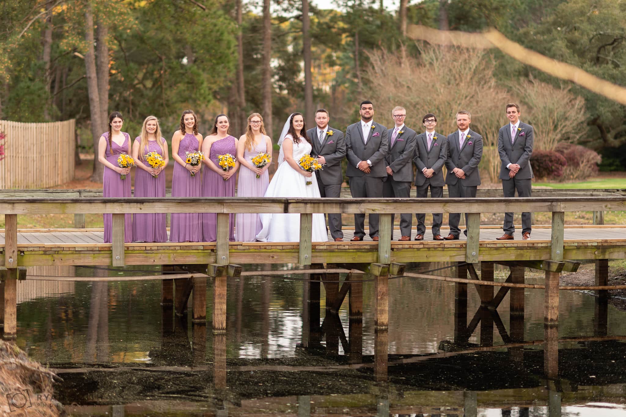 Bridal party standing on the bridge Litchfield Country Club