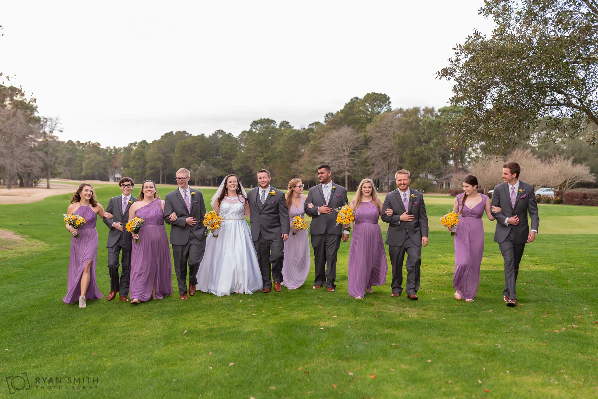 Bridal party walking down the golf course Litchfield Country Club