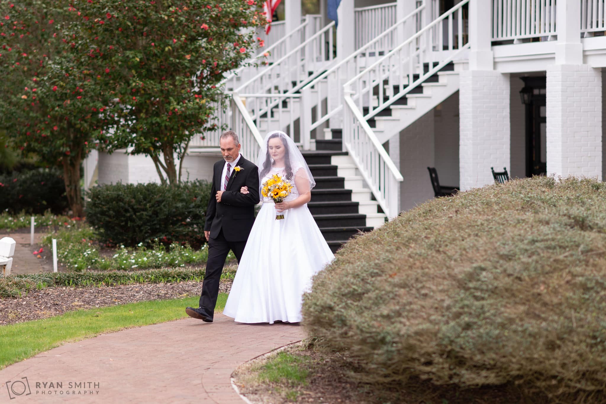 Bride and father walking towards the ceremony Litchfield Country Club