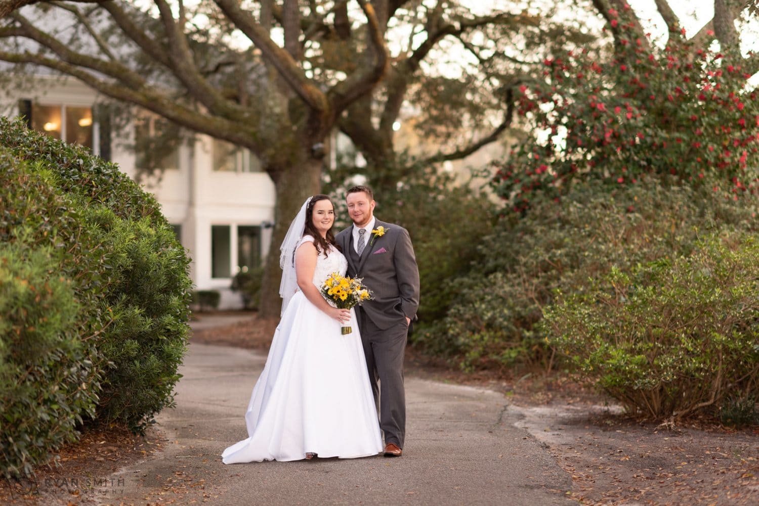 Bride and groom on the golf cart path Litchfield Country Club