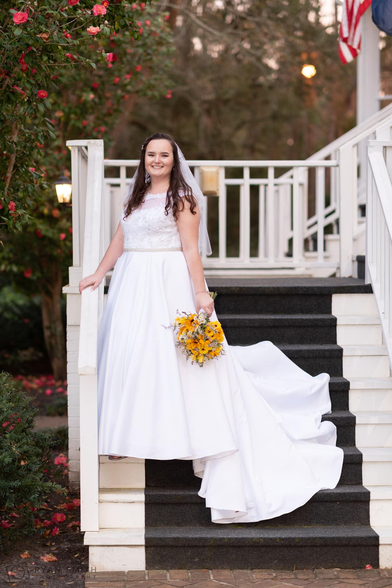 Bride posing on the front steps  Litchfield Country Club
