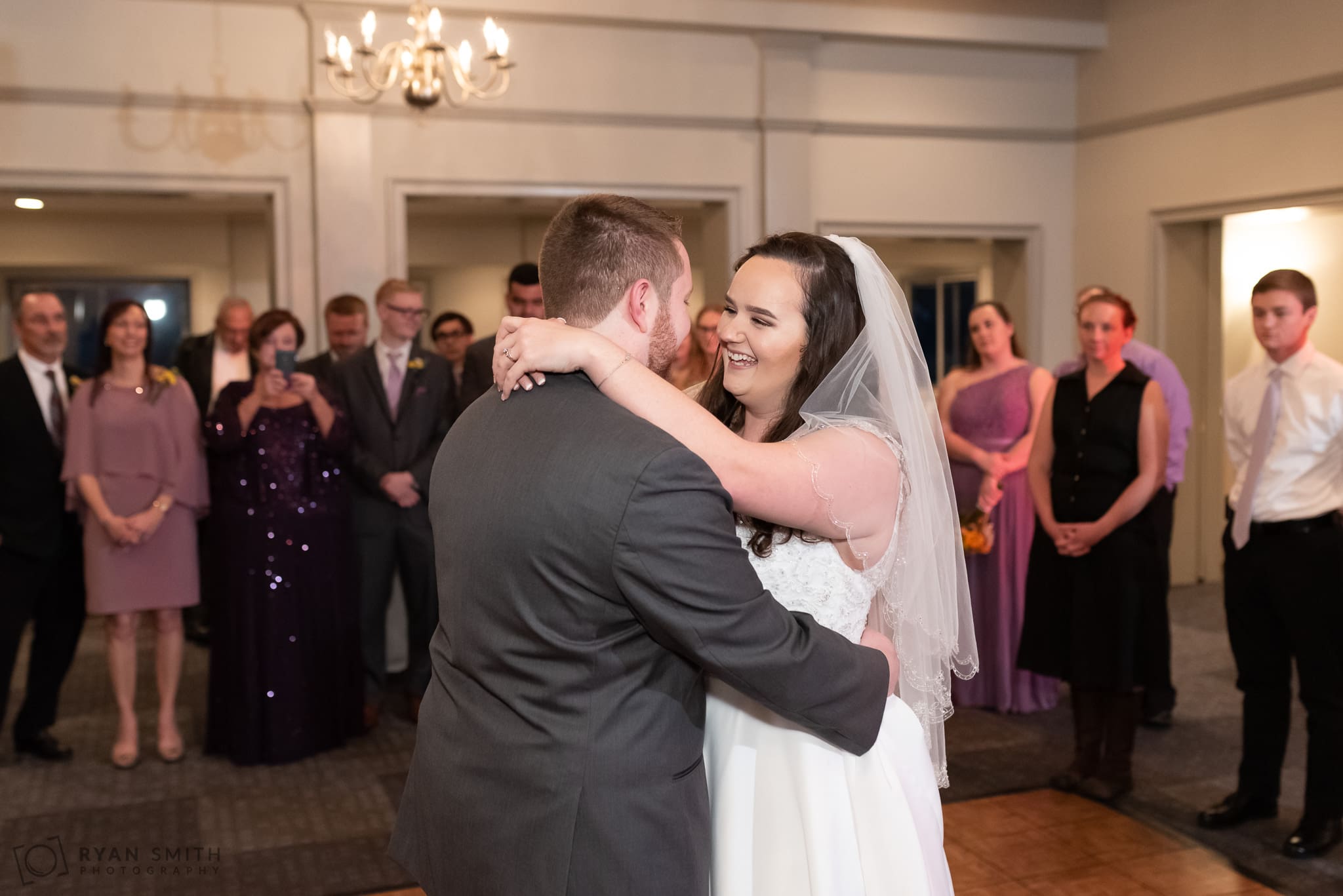 Bride smiling at groom during the first dance Litchfield Country Club